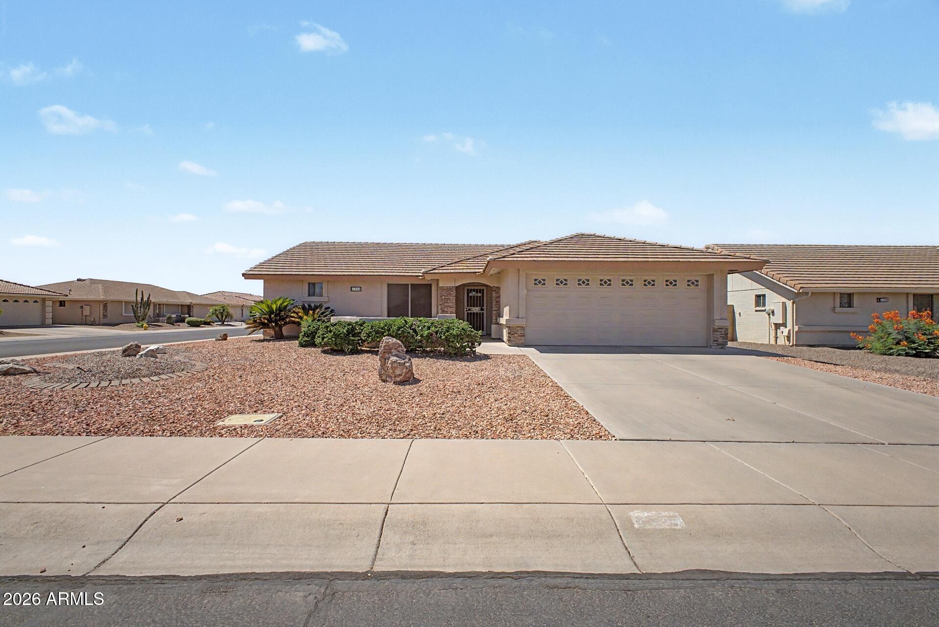Welcome to Sunland Springs Village, a premier 55+ active adult golf community in Mesa! This well-maintained 2-bedroom, 2-bath home features an open floor plan, cathedral ceilings, neutral paint, and abundant natural light. The spacious kitchen offers white appliances, filtered water, ample counter space, and crown molding cabinets. The primary suite includes dual closets, while upgrades include ceiling fans, security doors, instant hot water circulation, new tile floors in the bedrooms, and extra garage storage. Enjoy two private patios, including a tiled back patio with pull-down shades. Close to golf, shopping, restaurants, hospitals, and community amenities. Move-in ready and a must see!