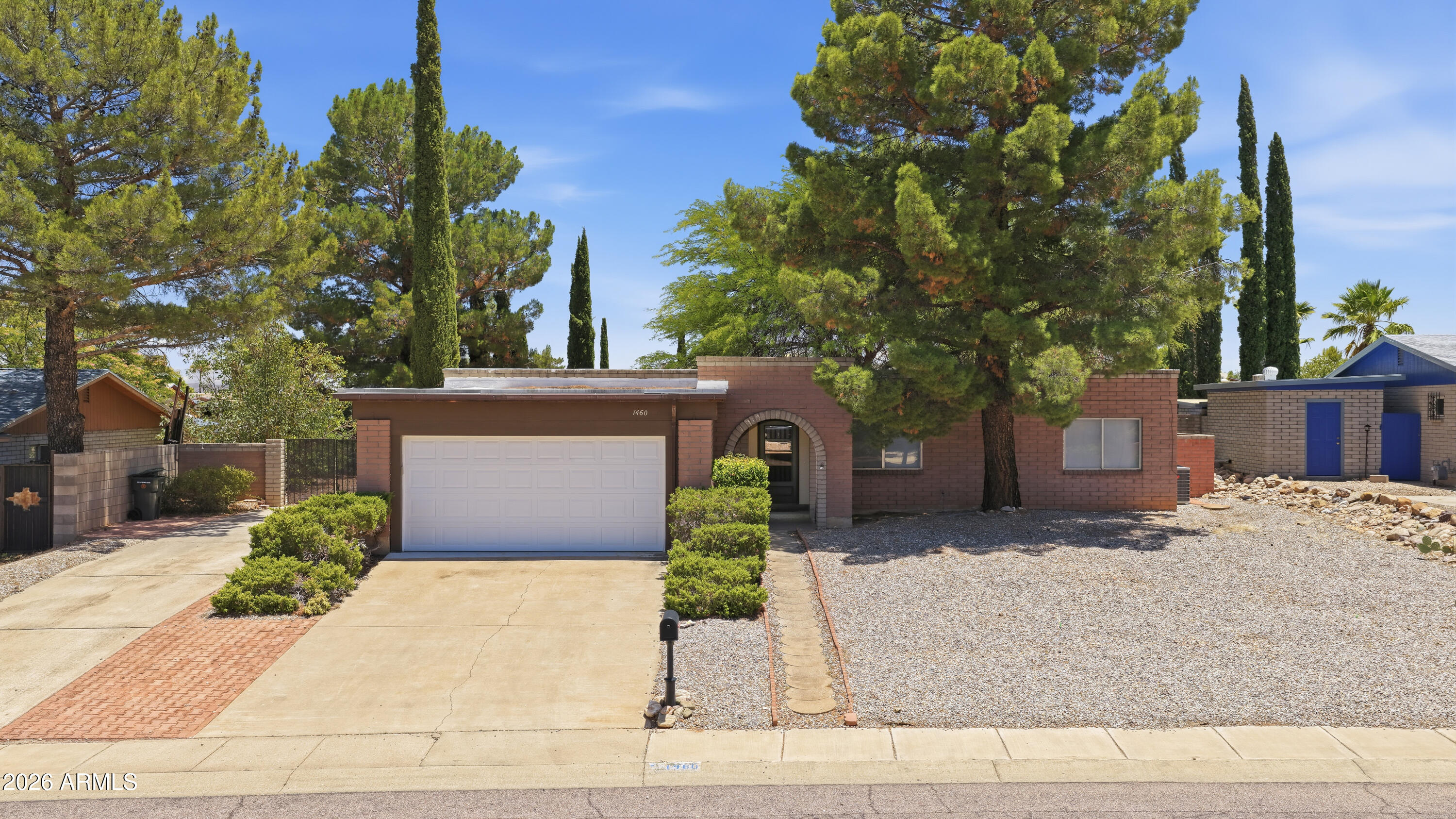 Don't miss this Sierra Vista gem minutes from Fort Huachuca! This 4-bed, 2-bath home boasts 2,250 sq ft of bright living space with 2022 paint & flooring updates throughout. Enjoy a gorgeous kitchen with 2022 countertops & stainless appliances. The  master suite is a true retreat, featuring French doors opening to the yard, plus a huge walk-in closet & oversized shower. Both bathrooms were also beautifully updated in 2022! The crown jewel is the sprawling, rare quarter-acre lot! Includes a 2-car garage, double driveway, RV gates & a good-sized workshop. The private backyard is a landscaped oasis with mature trees & a huge pool-ready footprint. Unbeatable space & location. Tour today before it's gone! Owner Agent