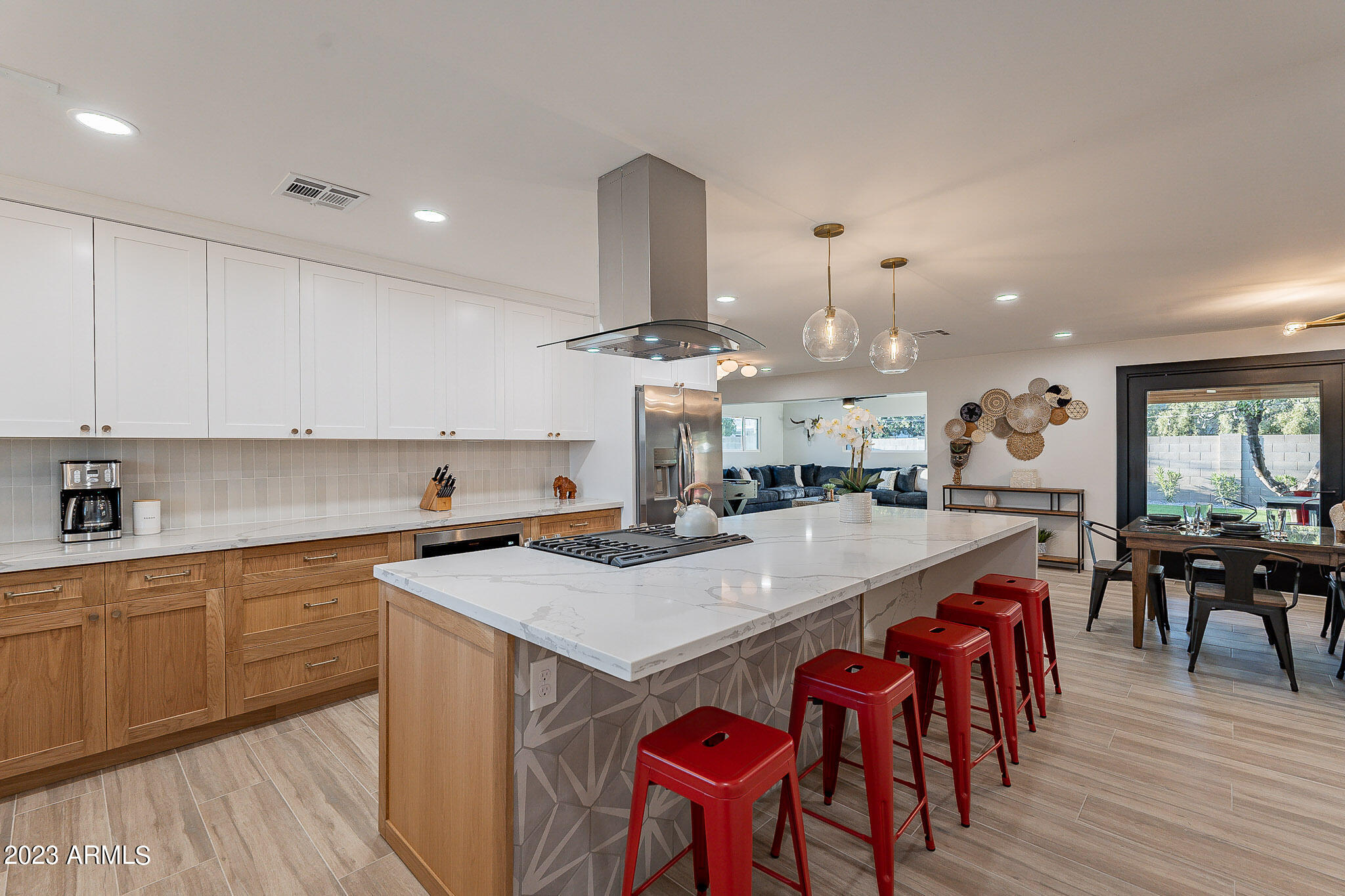 Fully furnished and beautifully remodeled, this 3-bedroom Scottsdale home features three king beds, a flowing open layout, and premium finishes throughout. Enjoy peace of mind with upgraded dual-pane windows, newer A/C, and added attic insulation for energy efficiency. The resort-style backyard is built for fun with a putting green, built-in bar, grill station, corn hole, and low-maintenance turf. A spacious 2-car garage adds convenience, and monthly landscaping is included with rent. Just four minutes from Old Town's dining, shopping, and nightlife. 12-month++ lease preferred.