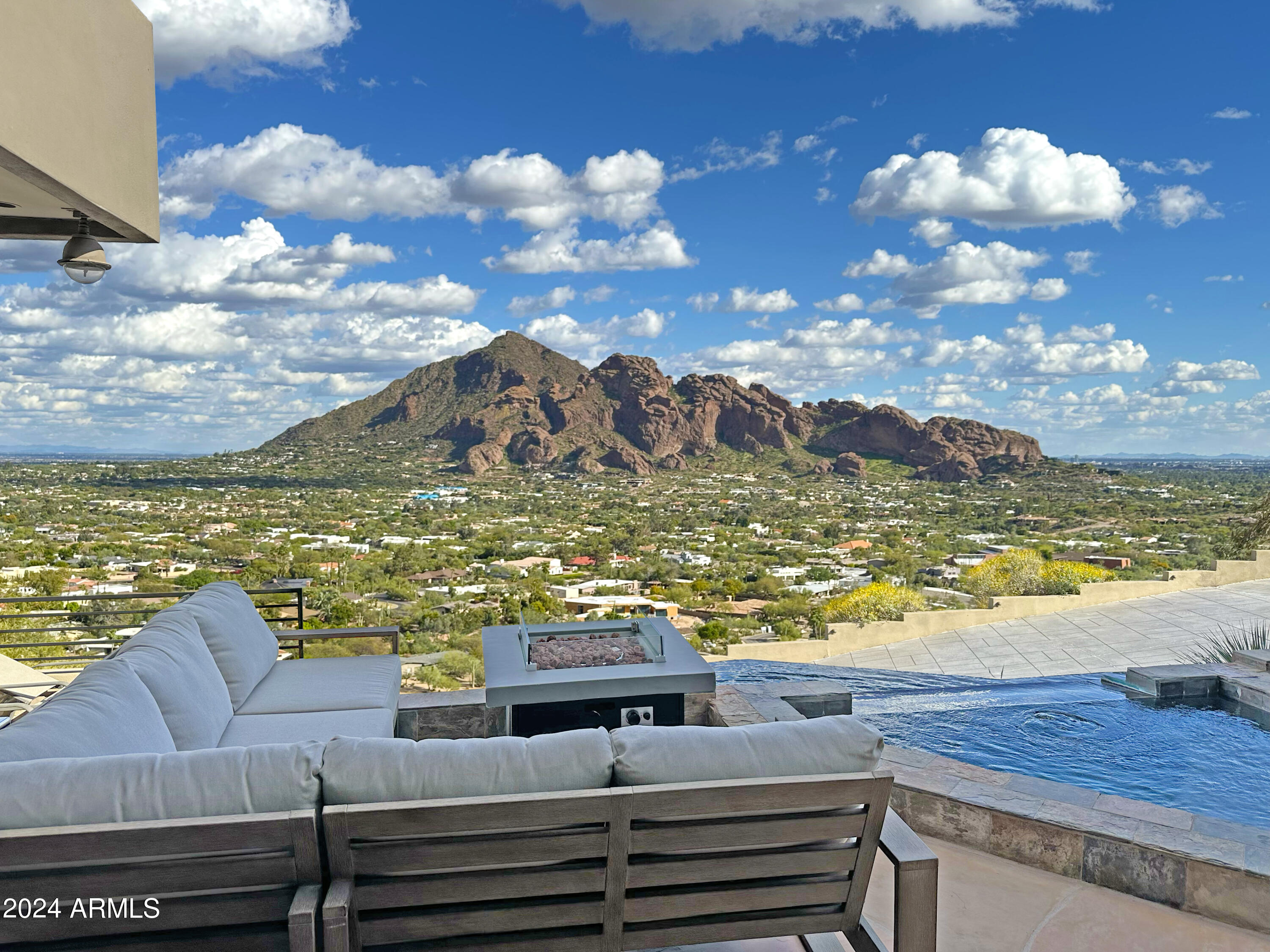 HUGE $500K PRICE DROP! Motivated Seller! SPECTACULAR VIEWS. Where else can you get ALL THIS:

One-of-a-kind hillside with UNOBSTRUCTED panoramic views of Camelback, Phoenix Skyline, Mummy Mountain, and PV fireworks.

Your family and guests will be amazed by 5 view decks and the heated infinity pool & spa that let you feel like you're swimming into a limitless Arizona horizon.

Perfectly positioned for privacy: no neighbor directly on top of you. Quiet dead-end street. And the desert hillside is a fortress that naturally shades & cools the house in the afternoons.

All bedrooms are en suite with balcony/patio access including TWO Primary Suites! Floor-to-ceiling windows, two-story waterfall, 3 fireplaces, 2 wet bars, and temp-controlled pantry/wine room.

WATCH THE VIDEO! ***

8 AVMs (Automatic Valuation Models) value this home at an average of $5.05 MILLION! (Accessed 9/1/24: ATTOM, Movoto, Chase, Home Valuation, Realtordotcom, Public Data, Pennymac, and Wells Fargo).

Don't miss this incredible opportunity to own a premium trophy location in Arizona's most prestigious ZIP code at a HUGE discount.