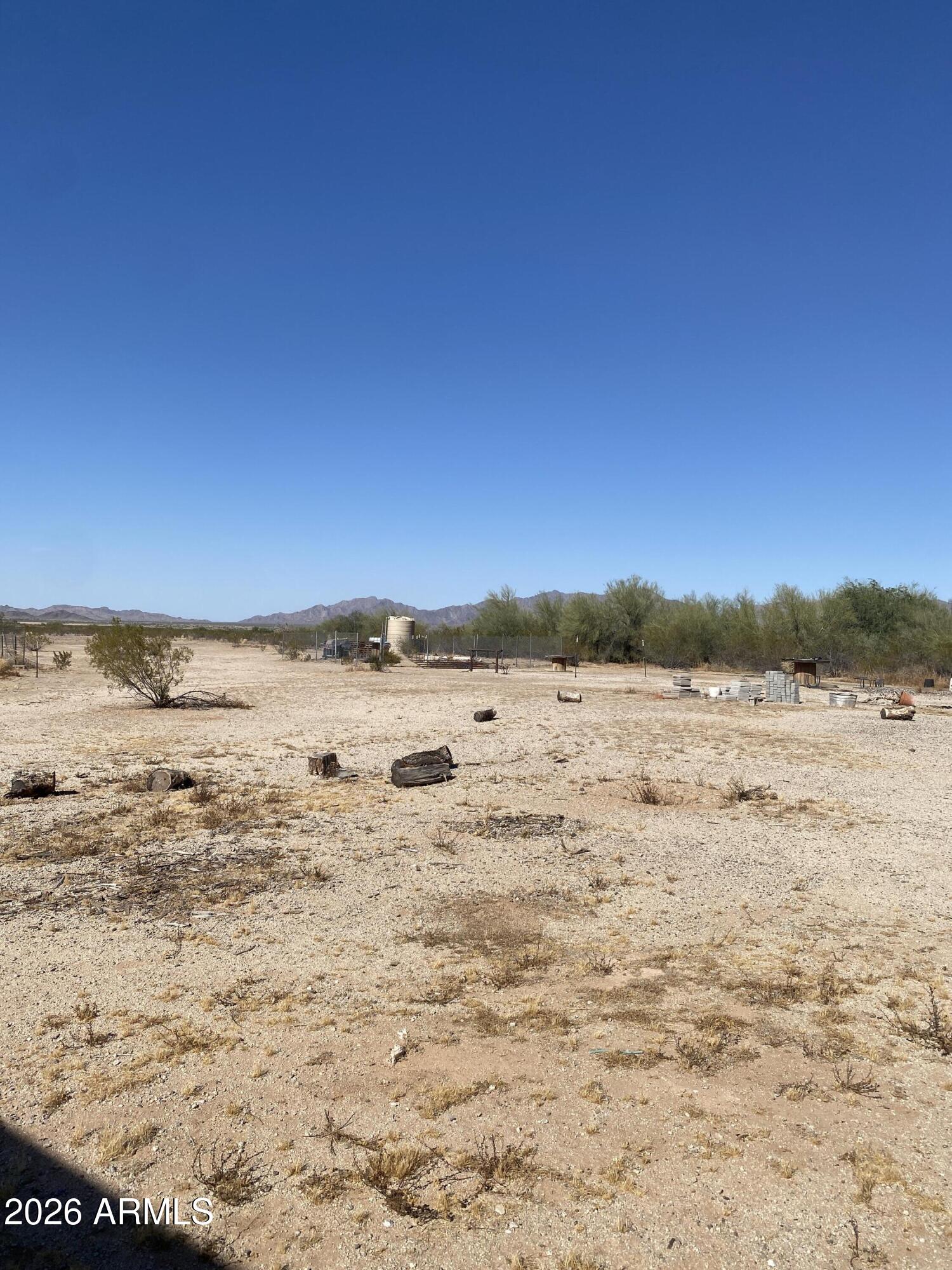 Option to buy 4 acres for $150,000 or the 10 acres for $325,000. Discover the freedom and possibilities of rural living with this beautiful 10-acre property in the highly desirable Rainbow Valley area. This ready-to-build
parcel already features a private well, electricity on the property, and an existing septic system -- saving you time and money as you bring your vision to life.
Surrounded by breathtaking mountain views and Arizona's peaceful desert landscape, this property offers the perfect setting for a custom home, ranch, farm, or
weekend retreat. With plenty of space for horses, livestock, toys, or future expansion, you can enjoy the privacy and open space that make Rainbow Valley so
special while still being within reach of city conveniences.