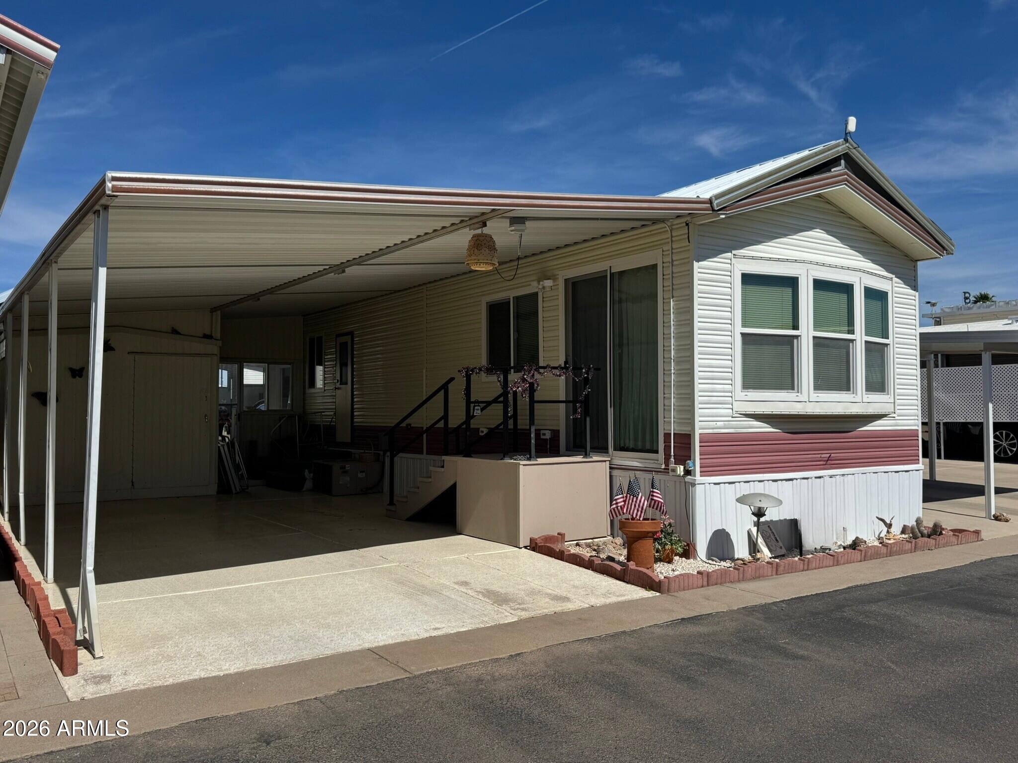 BACK ON MARKET!!  This 1-bed park model in Florence offers simple desert living in Caliente Casa de Sol where you own the land. Built in 1988, this Cavco Carme Park Model features 1 bedroom, 1 bath, and 408 sq ft of living space on a 30x41 lot located on the sunny side of the street. Great potential with light TLC.  Home offers a layout with comfortable living, dining, and kitchen space. Situated on the sunny side of the street, and has excellent natural light. A little TLC will make this an ideal winter retreat or full time residence. Caliente Casa de Sol is a gated 55+ active adult community in Florence, Arizona known for its active lifestyle and well maintained environment. Residents enjoy access to a heated pool and spa, clubhouse with organized social events, fitness center, pickleball and shuffleboard courts, billiards and card rooms, library, hobby and craft spaces, and a full calendar of community gatherings throughout the year. The community is privately maintained with attractive desert landscaping, wide streets, and beautiful mountain views. Land ownership provides long term value and stability, making Caliente Casa de Sol a popular destination for both seasonal visitors and full time residents seeking relaxed Arizona living in Florence.