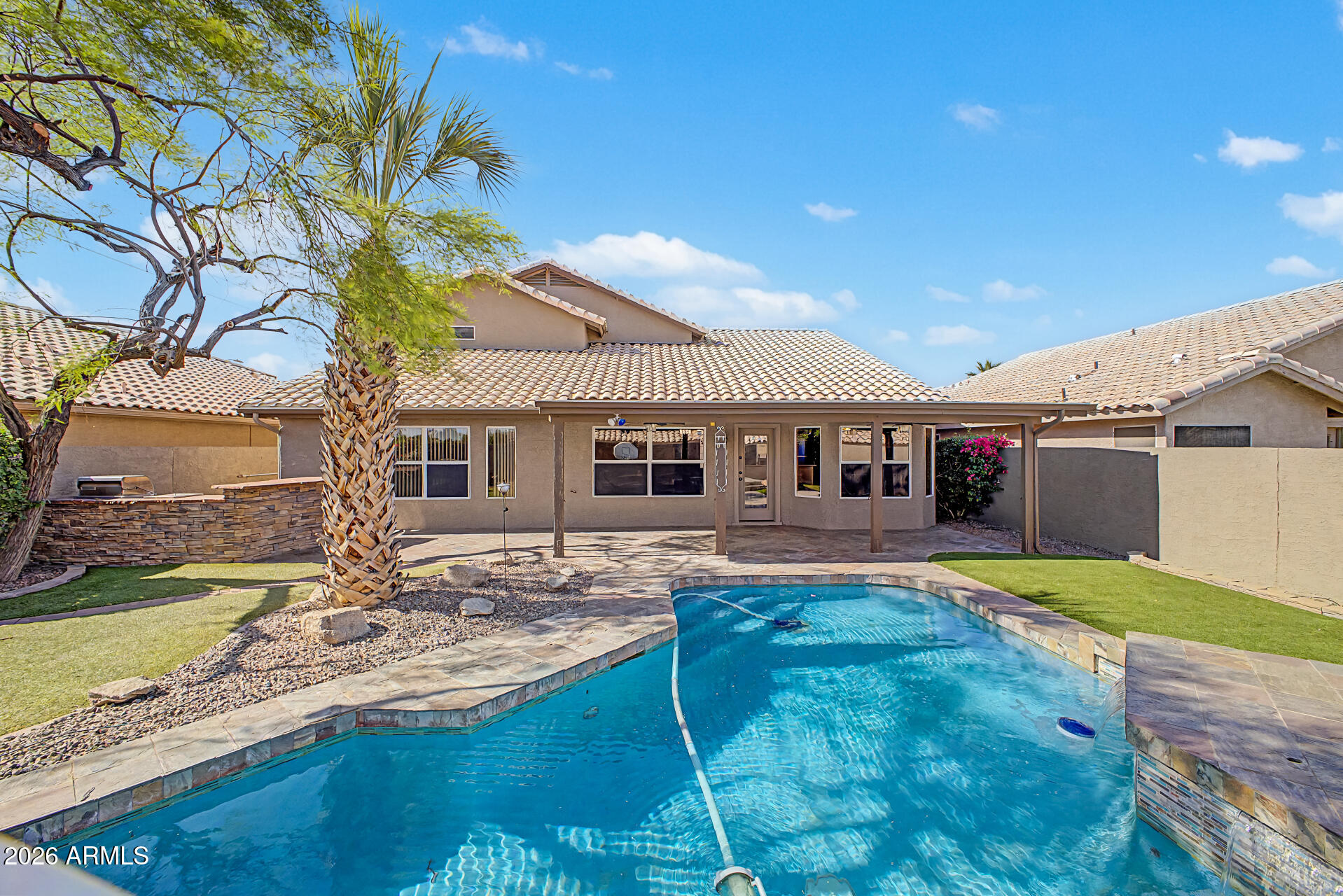 Location + rare 5 bedrooms + downstairs primary bedroom + 3 car garage + resort style backyard!!  Pride of ownership is evident throughout the home which also includes newer roof (2018), newer HVAC systems (2018), updated pool (2020), new turf (2026), new carpet (2026), & new exterior & perimeter wall paint (2026).  Located within the coveted MPR HOA, you get access to all 3 parks. The closest park being a 10 min walk or 3 min bike ride that offers pool, hot tub, cabanas, sport courts, playground, volleyball & basketball court, & a large grassy area. Even more, being located near the wash walking path means a 7 min walk to Esperanza Elementary & a 5 min bike ride to Sun Ray Park. This is a home that has been lovingly cared for with all major items taken care of for years to come & ready for the next owner to be proud to own.