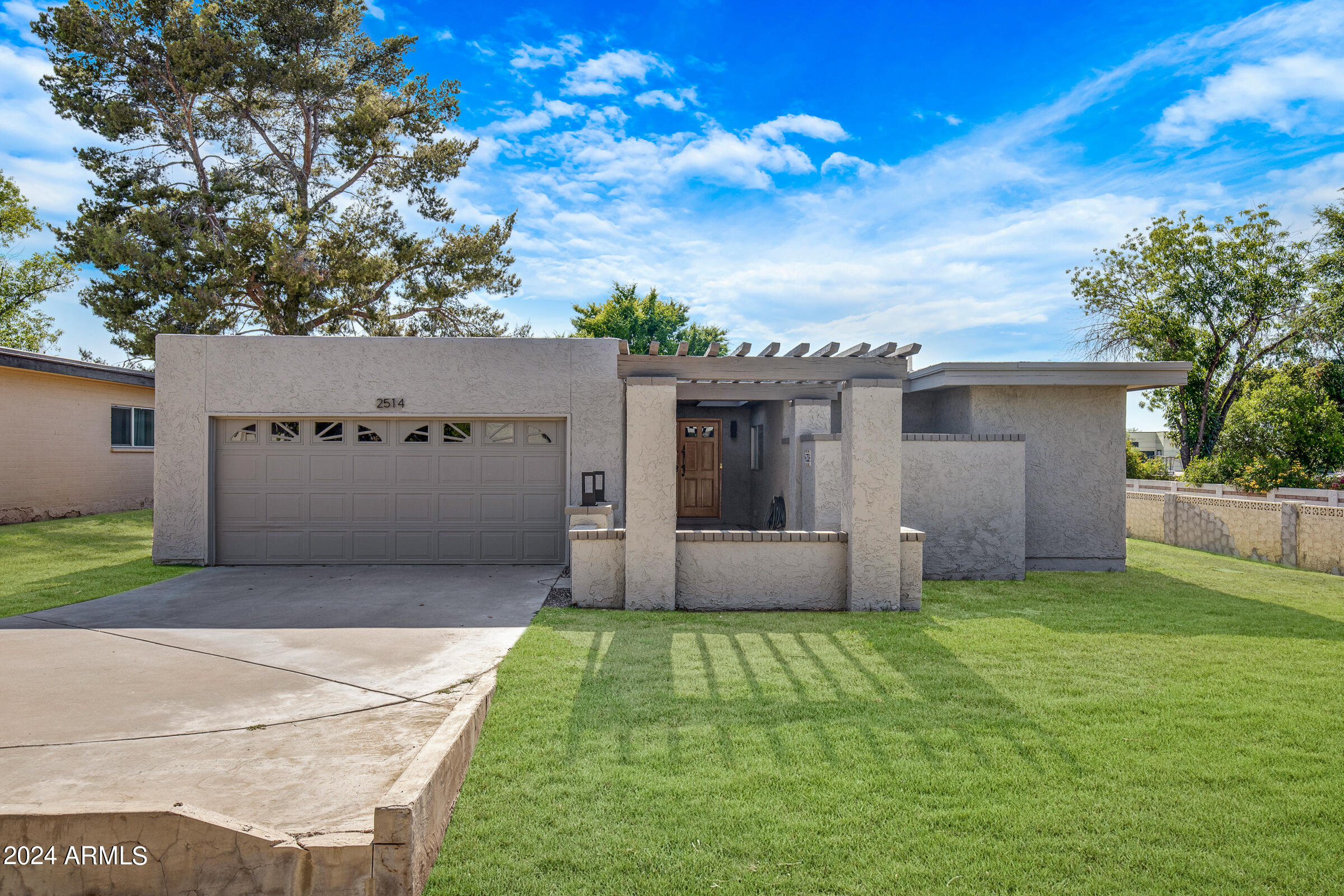 Rare opportunity awaits in the highly coveted Heritage East community. This stunning patio
home includes breathtaking views of the Papago Buttes to the South and Camelback Mountain to the North. Recently renovated, this home features gleaming hardwood floors, custom cabinets, luxurious quartz countertops and a spacious island. The well-designed layout offers split bedrooms for maximum privacy, while designer tile, upgraded vanities, and fixtures adorn the meticulously crafted bathrooms.