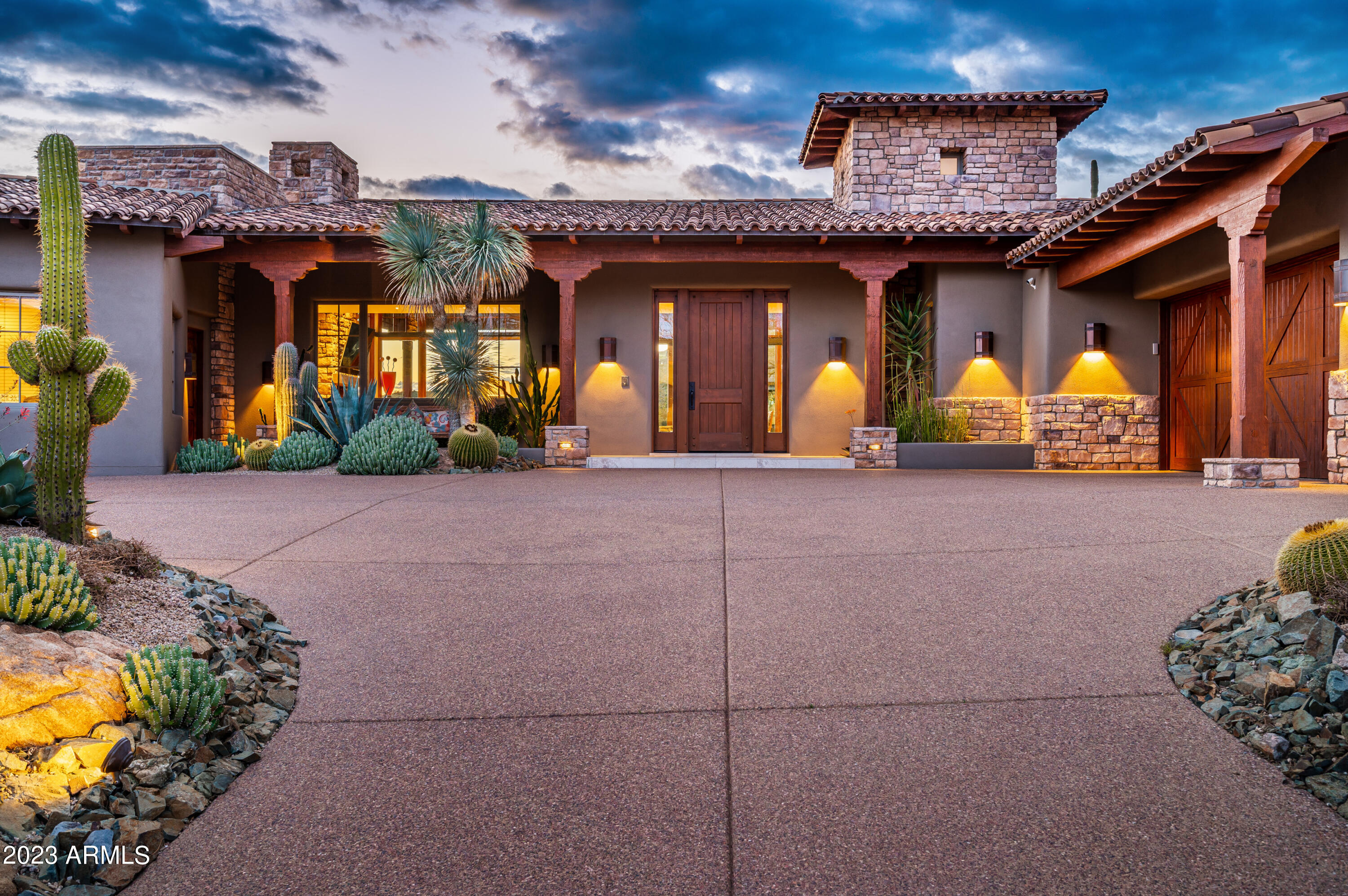 Gracious Arizona Ranch-style home designed by Bing Hu with GOLF MEMBERSHIP to DESERT MOUNTAIN CLUB available. Prime Saguaro Forest location on Chiricahua's 10th  fairway  features broad SW  views.  Noteworthy desert landscaping provides impressive curb appeal and a stunning resort patio setting. Abundant, natural lighting throughout the day, and magical evening ambiance.  Vaulted ceilings, stone floors, with main rooms opening to view patio.  Expansive great room; chef's kitchen with family room and cozy breakfast nook. Spacious master with exercise room. Private guest wing has own gardens which double as gated  ''pet resort.'' 4th ensuite BR  is furnished as office with pvt entrance. Multiple  outdoor entertainment areas for sun and shade. 30 day membership application process