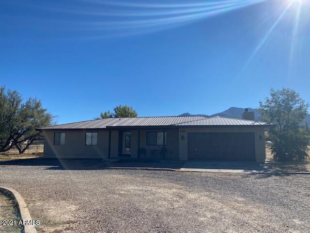 Come see this beautiful home with mountain views. This 3 bedroom 2 bath home has wood look tile throughout, and carpeted bedrooms, a metal roof, granite countertops, and stainless steel appliances in kitchen. Call today!
