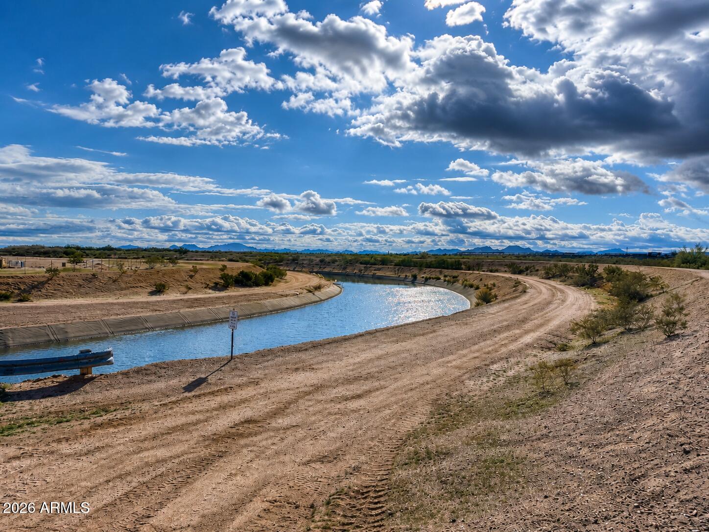 27.19 Acres with Canal Frontage, Power & Paved Road Access - Stanfield, AZ

Rare opportunity to own 27.19 acres of General Rural (GR) zoned land in the growing Stanfield corridor of Pinal County. This unique property offers approximately 1,300+ feet of frontage along Stanfield Road and over 1,400 feet of canal frontage, creating a combination of accessibility, privacy, and natural beauty that is difficult to find.

The property features power along the road frontage, excellent access, mature desert vegetation, and beautiful mountain views in multiple directions. Neighboring properties include established residences and agricultural uses, providing a balance of rural living and convenience. Located just minutes from Interstate 8, the property offers easy access to Casa Grande, Maricopa, Phoenix, and Tucson while maintaining the peaceful setting that rural acreage buyers seek.

The parcel is zoned General Rural (GR) with a minimum lot size of 1.25 acres. Buyers are encouraged to verify all development, split, and use possibilities with Pinal County.

Whether you're looking for a custom home site, horse property, recreational retreat, investment hold, or future development opportunity, this property offers exceptional flexibility and long-term potential.

Property Highlights:

* 27.19 Acres
* General Rural (GR) Zoning
* 1,323' of Stanfield Rd Frontage
* 1,400' of Canal Frontage
* Power Available Along Frontage
* Easy Access to Interstate 8
* Pinal County verified - not in 100yr or 500yr Flood Zone (Zone X)
* Mountain Views
* Established Agricultural & Residential Area
* No HOA