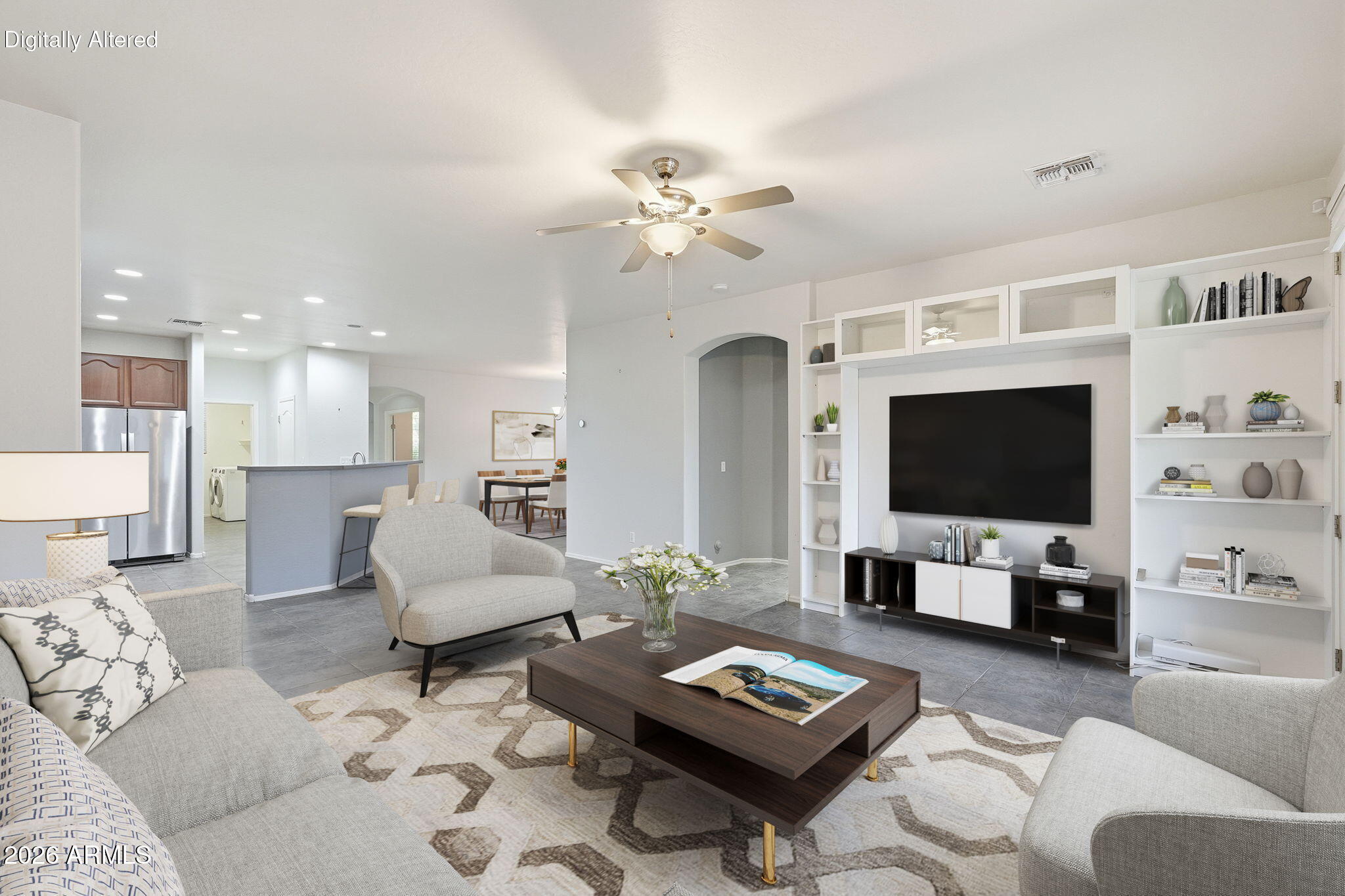Spacious and beautifully maintained, this single-level home offers over 2,000 sq. ft. with a desirable split floorplan featuring 3 bedrooms, 2 baths, a private den, and a 3 car garage. The primary suite includes dual sinks, soaking tub, separate shower, and walk-in closet, with walk-in closets in every bedroom!  Enjoy an open kitchen overlooking the family room and dining area with newer appliances, plus a new TRANE HVAC system and TANKLESS water heater. The backyard shines with turf, flagstone paths, and a paved seating area. Located in a beautiful community with 2 pools, greenbelts, and walking paths.  It's also walking distance from the very popular, 28-acre Pacana Park, with a dog park, fishing lake, basketball court, ramadas, a large playground, and a fitness area.
