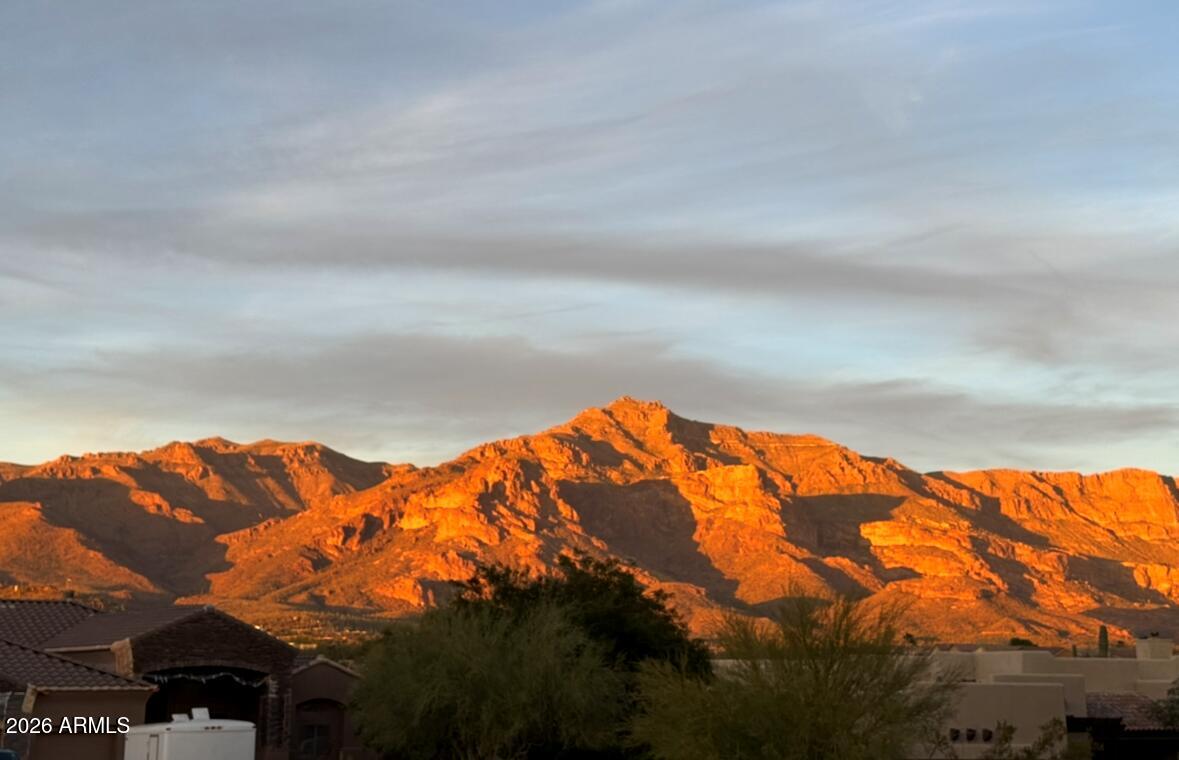 Stunning 0.57-acre homesite in a prestigious custom neighborhood, nestled between the Superstition and Dinosaur Mountains ,in the highly desirable Gold Canyon East community. Enjoy breathtaking Superstition Mountain views from your backyard and dramatic Dinosaur Mountain views from the front. Surrounded by beautiful custom homes, this premium lot offers the ultimate flexibility with no required build timeframe--design and build your dream home whenever you're ready.