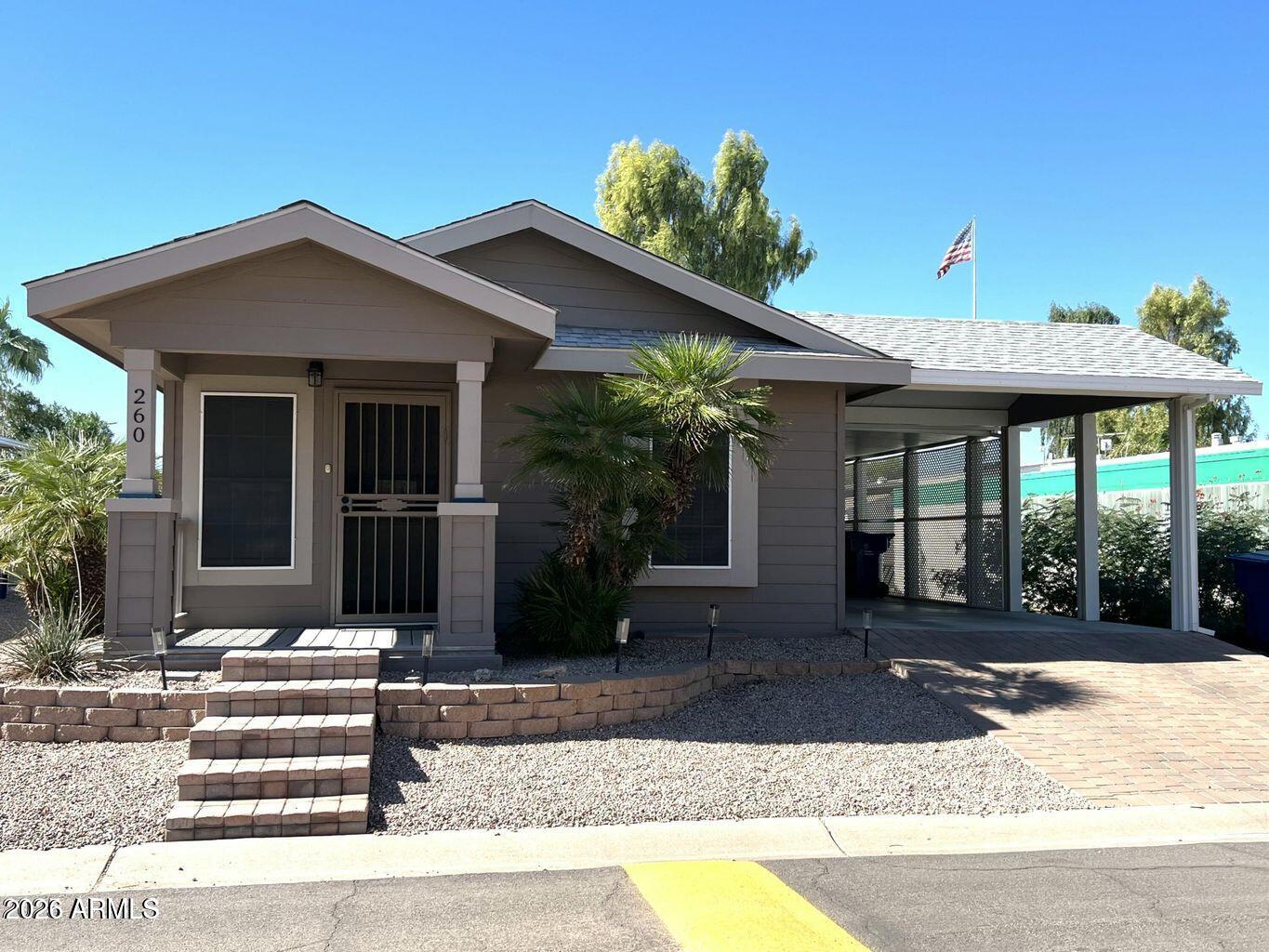 Move-in ready and full of charm, this newer home is nestled in a welcoming 55+ guard-gated community in a prime Tempe location. Offering 1 bedroom and 2 bathrooms, the open floor plan features stylish vinyl plank flooring, a spacious ensuite bath, and a well-appointed kitchen with abundant cabinet space. The inviting front porch is perfect for relaxing or entertaining guests, while the covered carport accommodates 2-3 vehicles. A Tuff Shed provides valuable additional storage.Located in a vibrant land lease community with on-site security, residents enjoy access to walking trails, a heated pool and spa, and an active clubhouse filled with social events and activities. Pets are welcome, and the convenient Tempe location offers easy freeway access and is close proximity to Sky Harbor Airport