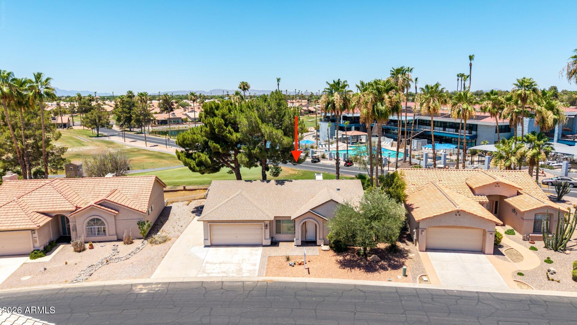 Beautifully maintained former model home featuring the highly sought-after Ventura floor plan located on Hole #1 of the Sunbird Resort Golf Course!! Offering 2 bedrooms, 2 bathrooms, and a long list of thoughtful upgrades throughout. Major improvements include a NEW roof (2025), owned water softener (2024), R/O system (2023), updated dual-pane Low-E reflective windows with transferable lifetime warranty, newer garage door opener and rollers, new microwave, garbage disposal, kitchen faucet, and updated quarter-turn shut-off valves throughout the home (2025). The washer, dryer, refrigerator, and black kitchen appliances are all included, making this truly move-in ready. Inside, you'll appreciate the tile flooring, plantation shutters, solar tube in the laundry room, updated hardware, door handles, mirrors, faucets, towel bars, and slow-close toilet lids throughout. The spacious primary suite features a rain glass window, updated bath fixtures, and a refreshed feel.

The kitchen opens seamlessly to the living area and features a newer thermostat, R/O system, and alarm indicator for the garage door. Additional upgrades include updated interior water lines, a new utility door, fresh paint in several areas of the home, and numerous maintenance items already completed for peace of mind.

The garage offers built-in storage cabinets, a workstation, and a painted interior.  Outside, enjoy a large lot with mature landscaping, two orange trees, front pavers added in 2022, back pavers added in 2024, landscape drip system upgraded to PVC with timer controls, decorative rock landscaping, and a covered patio perfect for relaxing or entertaining. The home also benefits from a former solar hot water system conversion that has been converted back to electric, however there are still two tanks present. 

With meticulous care, extensive upgrades, no better lot being literally steps away from the Clubhouse and all the fun activites offered, extra parking on the driveway, and a transferable termite contract in place, this former model home is the perfect combination of comfort, convenience, AMAZING views of our AZ Sunsets and true pride of ownership.