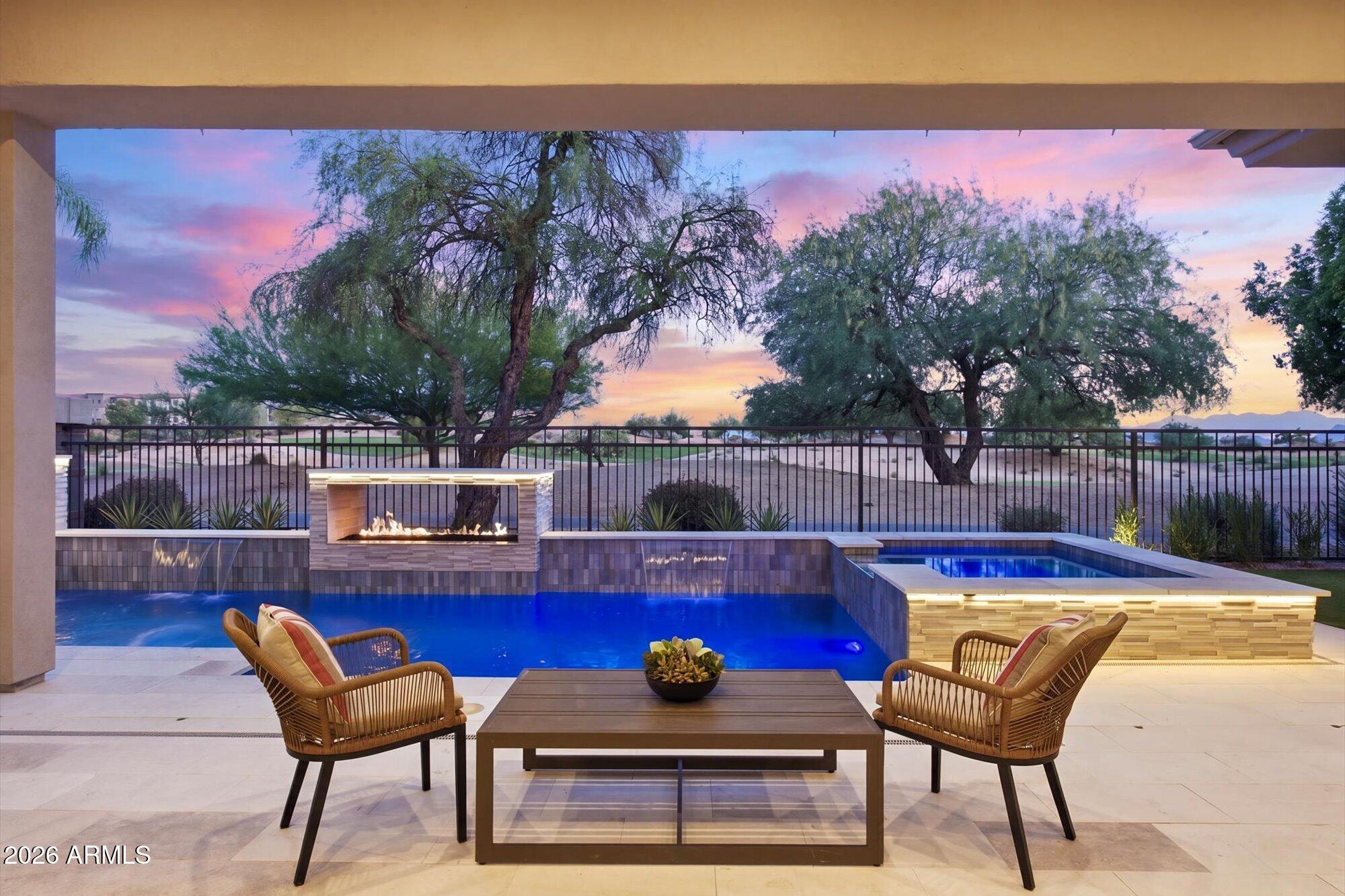 Wake up overlooking the Westin Kierland Golf Course, spend afternoons by your private resort-style pool, and walk to Scottsdale Quarter for dinner--all from one of Kierland's most coveted gated enclaves. Expertly reimagined by Bravia Homes, this open-concept residence blends modern luxury with timeless design, featuring soaring ceilings, retractable glass walls, wide-plank engineered oak flooring, and seamless indoor-outdoor living. Entertain with ease in the chef's kitchen showcasing Belmont VERO walnut cabinetry, Wolf/Cove appliances, a 48'' Sub-Zero refrigerator, and a quartzite waterfall island. Unwind in the luxurious primary suite with a gas fireplace, custom closets, dual vanities, dual showers, and a sandstone soaking tub. With new roof, HVAC, plumbing, pool, spa-luxury turnkey. Welcome to 6915 E Montreal Place -- a stunning reimagination of a classic Calvis Wyant-built home, originally constructed in 1999 and now completely transformed by Bravia Homes, one of Scottsdale's most sought-after remodelers. Bravia has built a powerful reputation for taking well-loved floor plans and converting them into contemporary residences that radiate warmth, function, and form -- delivering a living experience typically found only in homes of far greater value. This is not a cosmetic refresh. This is a ground-up reinvention.
THE INDOOR-OUTDOOR EXPERIENCE
The heart of this home is a breathtaking 24-foot sliding glass wall that dissolves the boundary between interior and exterior living. Step out to a stunning travertine patio and resort-style backyard featuring a saltwater swimming pool with Baja lounge shelf, a heated spa, cascading water features, and a truly unique see-through fireplace that frames panoramic views of the golf course at the Westin Kierland. Whether you are entertaining a crowd or enjoying a quiet evening, this backyard delivers a resort lifestyle every single day.
THE KITCHEN
A designer's dream -- anchored by all-new Bellmont cabinetry, Taj Mahal quartzite countertops with a full backsplash, and a premium appliance suite including Wolf, SubZero, and Cove. A built-in wine cooler, generous pantry, and abundant cabinet storage complete a space that is as functional as it is visually stunning.
THE PRIMARY SUITE
A private retreat unto itself -- featuring a natural gas fireplace, dual his-and-hers walk-in closets, and a spa-inspired ensuite bath with dual vanities, a large two-person shower, and a freestanding stone soaker tub. A true escape at the end of every day.
THE BEDROOMS
Four bedrooms include two ensuite baths, offering privacy and comfort for family and guests alike. One bedroom is perfectly suited as a flex room -- ideal for a home office, yoga studio, or creative space -- with a spectacular view of the backyard, pool, and golf course beyond.
THE GREAT ROOM
The open great room concept flows effortlessly from the kitchen through the living area, anchored by a vapor electric fireplace. The see-through outdoor fireplace adds warmth and architectural drama visible from both inside and out -- a signature Bravia design touch.
REBUILT FROM THE GROUND UP
Every major system and finish has been replaced or upgraded -- new roof with double underlayment, all new windows and sliding glass doors, new AC units and furnaces, new water heater and water softener, new washer and dryer, Nordic oak hardwood flooring and high-quality porcelain tile throughout, fresh interior and exterior paint, color-selectable designer lighting in every room, entire home wired with CAT-5 networking and coaxial cable in every bedroom, and all new bathrooms, fixtures, and ventilation.
STORAGE, GARAGE & LAUNDRY
A 3-car garage, dedicated laundry room, pantry, and abundant Bellmont cabinetry throughout ensure this home lives as practically as it looks gorgeous.
THE BRAVIA DIFFERENCE
Bravia Homes is becoming the name in Scottsdale remodeling -- taking homes with great bones and elevating them into something extraordinary. The craftsmanship here is second to none, the materials were hand-selected and meticulously matched, and the result is a home that feels custom-built from the ground up. All of it delivered at a value the new construction market simply cannot touch.
THE LOCATION
Just a short walk from Kierland Commons and Scottsdale Quarter -- Scottsdale's premier destinations for world-class dining, boutique shopping, and vibrant entertainment. Everything the city has to offer is right at your doorstep.