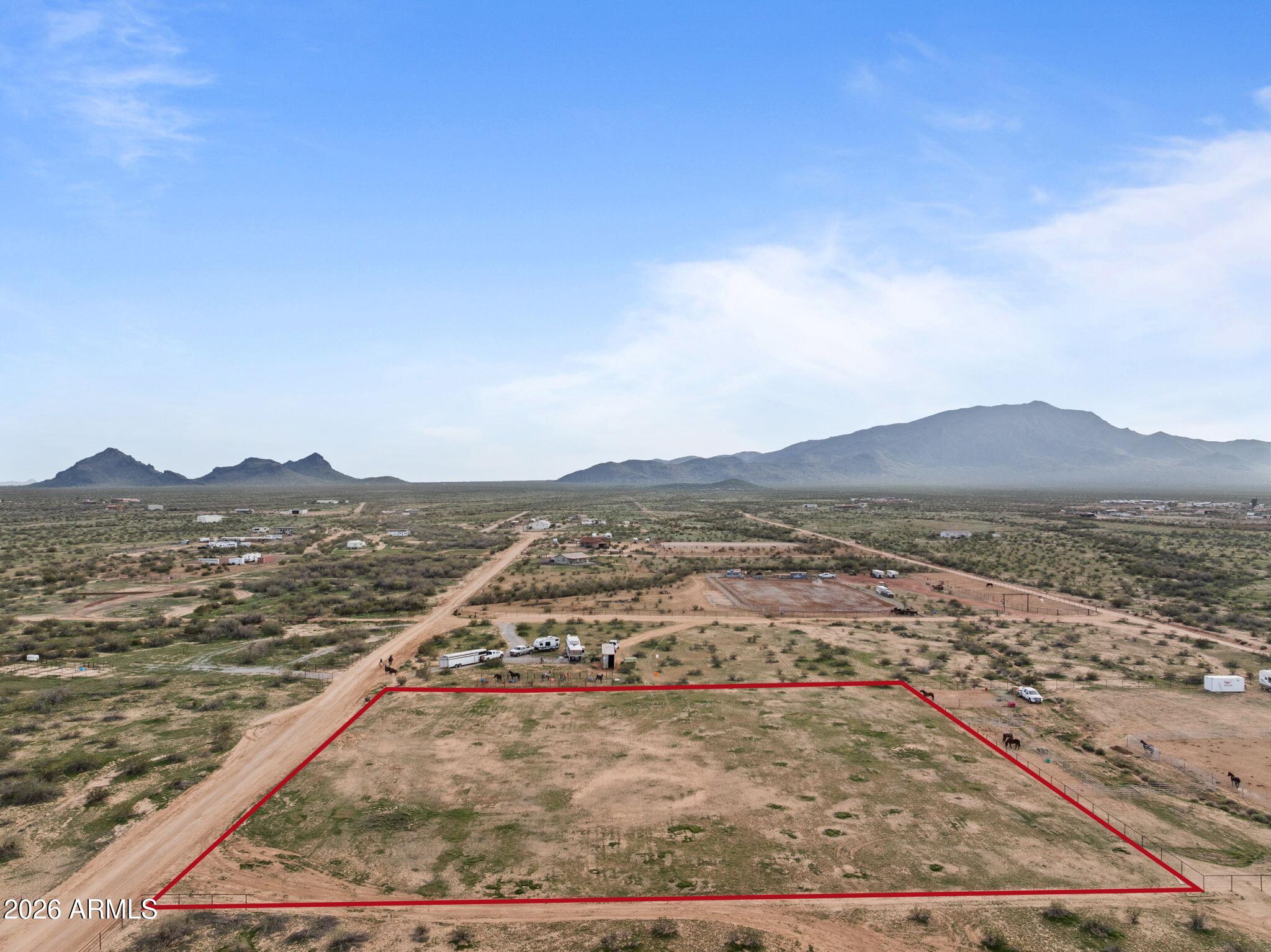 OWNER FINANCE AVAILABLE Welcome to this cleared and build-ready 2-acre parcel, offering a rare opportunity to start your project without delay. Full building permits have already been pulled, and the property is serviced by city water for added convenience. The west side of the parcel is fenced with approved fencing permits, providing a solid start to your site improvements. Enjoy beautiful mountain views, a great neighborhood setting, and close proximity to State Land, making it ideal for riding and outdoor recreation. Located just minutes from the Silver Bit Roping Arena, this property blends build-ready ease with a prime western lifestyle location.