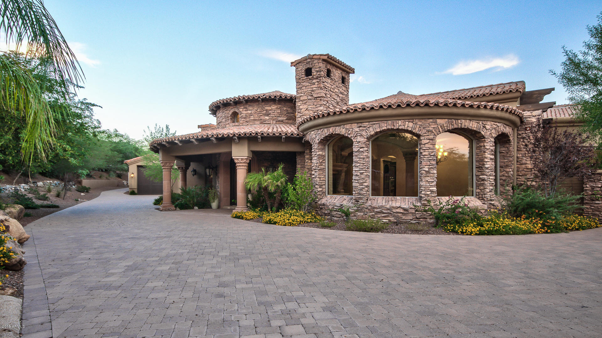 BEAUTIFULLY DESIGNED MASTERPIECE WITH GORGEOUS CRAFTSMANSHIP. THIS 5 BEDROOM WITH 6.5 BATH ESTATE FEATURES ARTISAN CEILINGS AND FAUX PAINTING THROUGHT-OUT THE HOME.CHEFS DREAM KITCHEN WITH GRANITE COUNTER TOPS AND BUILT-IN APPLIANCES WITH PLENTY OF COUNTER SPACE.THIS HOME IS TRULY A ENTERTAINERS DELIGHT at 10,198 SQFT WITH A STATE OF THE ART THEATER ROOM AND 2,000 BOTTLE WINE ROOM. YOUR GUESTS WILL NEVER WANT TO LEAVE WHEN THEY SEE THE PRIVATE ENTRY GUEST HOUSE WHICH HAS A KITCHEN AND FIREPLACE. OTHER AMENITIES THIS HOME FEATURES ARE CANTERA FIREPLACES,COLUMNS AND NICHES. ENJOY THE BACKYARD WITH HEATED POOL AND SPA AND BREATHTAKING VIEWS OF THE MOUNTAINS. BONUS FEATURE R.V.GARAGE. WALKING DISTANCE FROM HIKING AND MOUNTAIN BIKING TRAILS AT THE PHOENIX MOUNTAINS PRESERVE ACROSS THE STREET.