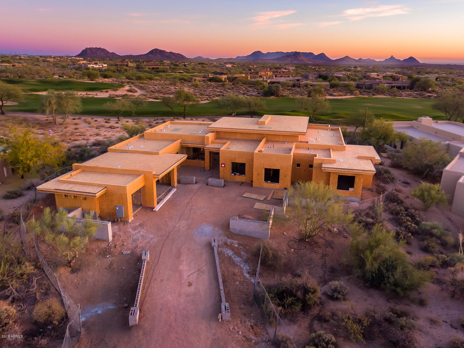 This home being built by premier luxury home builder Tierra Custom Homes is pass the framing stage.  South facing soft contemporary home is located on the 3rd hole of the Renegade golf course at Desert Mountain. The open floor plan has NO INTERIOR STEPS, expansive glass windows and doors, and has clean & light finishes. Great views of golf course, distant city lights & mountains. Large covered outdoor living spaces make this a wonderful home for entertaining or relaxing. The master retreat features private patio, exercise room, & ''spa'' style bath-all with views to the golf course. The home has two additional en-suites and an attached 593 sq ft casita plus a study. Estimated completion is summer 2018. Document section also has floorpan and renderings.