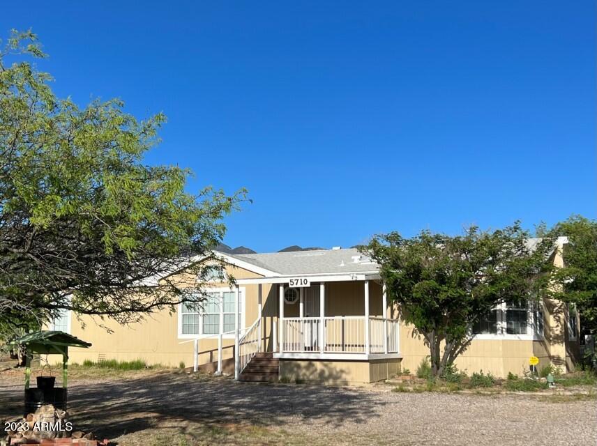 PRICE REDUCTION! Do you enjoy Country Living with Mountain Views?? THIS is the place for you! Located on a corner lot with 1+ acres of land and a fully fenced back yard with plenty of space to park an RV. The large storage building with electrcity can be a garage, workshop or?? This lovely home also has a built-in entertainment center, an Arizona room and a brand new roof in 2018. Call for a private tour today!
