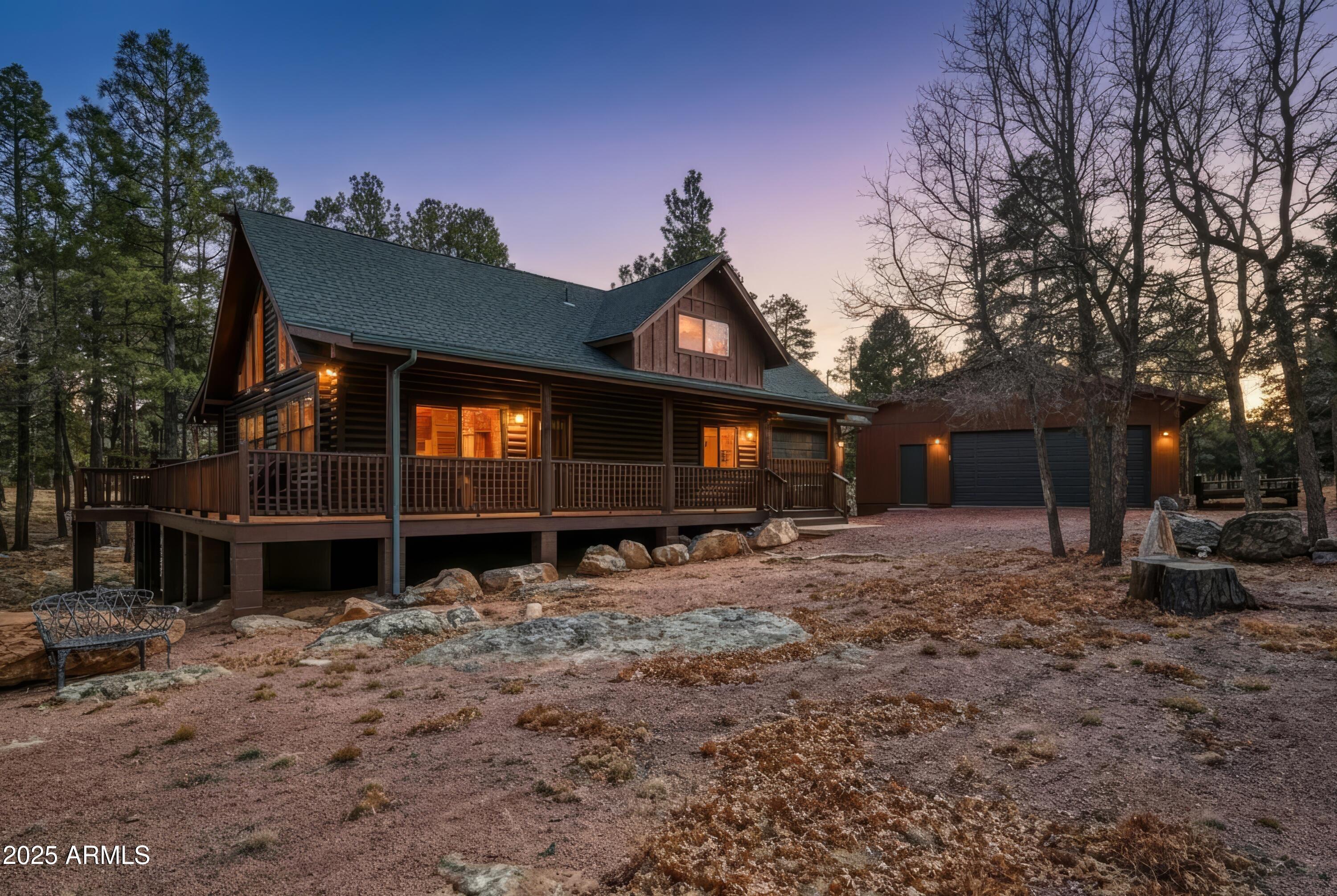 your favorite meals while you visit .This home offers both the cozy cabin feel with the log walls inside but also a modern home design An inviting loft offers an upper balcony, sitting area and large master bedroom/bathroom. The sitting area has versatile spaces, ideal for reading, work, or savoring sunrise views. The outdoor setting is equally compelling, set on almost an acre lot there is room for gardening, recreation, or simply unwinding amidst nature. An attached single car garage ensures secure, convenient parking, while the rare addition of a detached garage offers even more flexibilitythink of all the room for your toys, hobby workshop, or added space for adventure gear, as well as additional parking. Whether you dream of family gatherings, quiet evenings under the stars, or pursuing outdoor hobbies, this property provides the canvas for your ideal second-home lifestyle. Roof was just replaced and has warranty, recently stained exterior, its ready to move in and enjoy.  Located close to hiking trails and  Blue Ridge Reservoir, you have year-round access to boating, fishing, and hikingmaking every weekend or vacation an opportunity for new memories and outdoor excitement. Whether you're returning after a day on the water, hike on the trails, group ride with friends to experience the natural beauty of the area, you'll always appreciate the freedom this location affords.This move-in ready home invites you to create your own oasis and enjoy the flexibility and freedom that full time or second-home ownership provides..