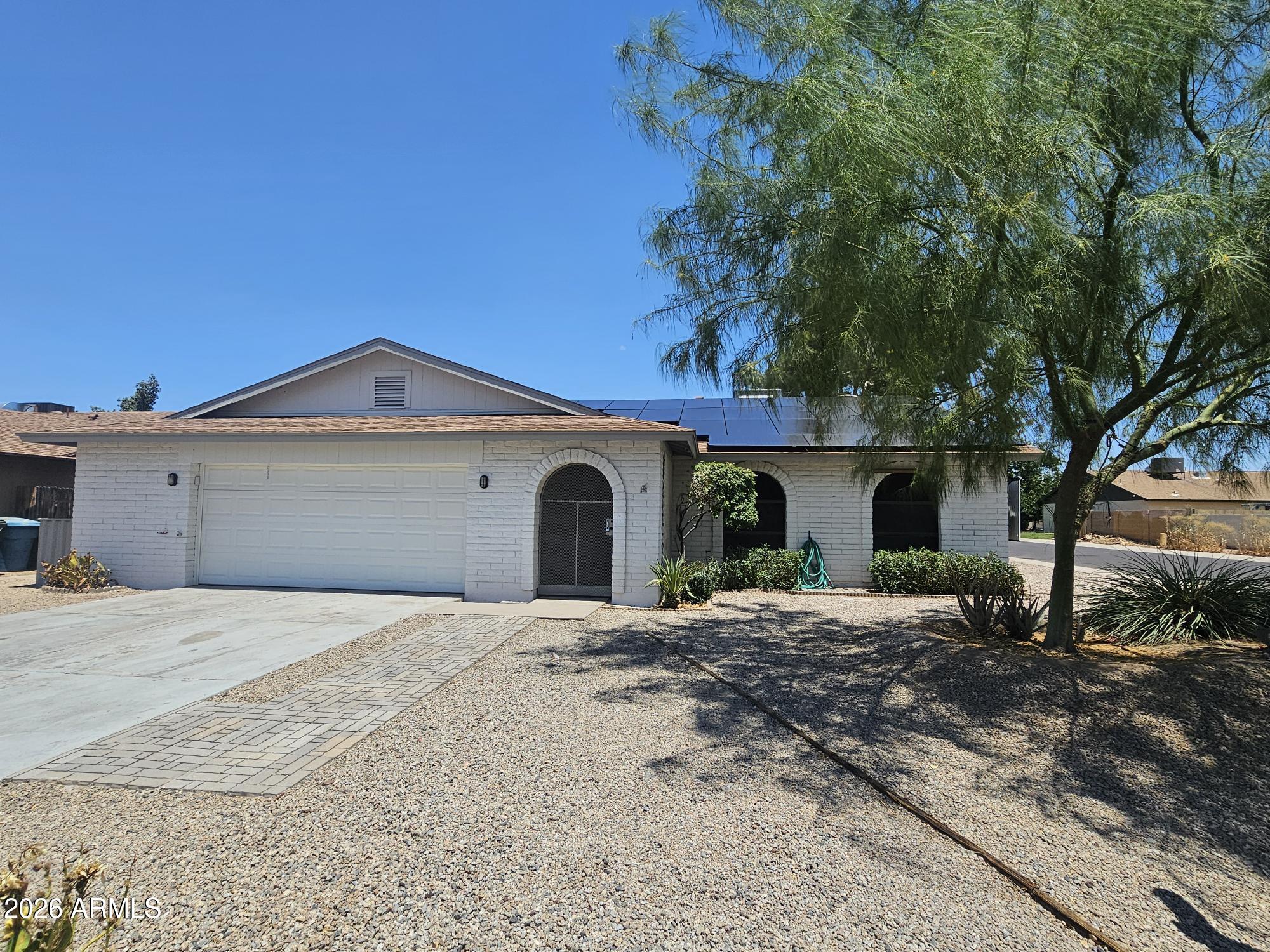 Beautifully updated single-level block home with NO HOA and owned solar for exceptional energy efficiency! This move-in ready home features 3 bedrooms, 2 bathrooms, fresh interior and exterior paint, and new commercial-grade laminate flooring throughout the main living areas with tile in wet areas.
The gourmet kitchen offers newer stainless steel appliances, a Thor electric range with matching hood, abundant new cabinetry, and granite countertops providing plenty of prep and cooking space. The spacious dining area is perfect for gatherings and features a cozy wood-burning fireplace that adds warmth and ambiance.  The large front family room overlooks the backyard and extended covered patio, creating a comfortable space for relaxing or entertaining. Additional upgrades include a newer roof and HVAC system, while the owned solar helps keep utility costs down. Step outside to enjoy the low-maintenance backyard complete with mature fruit trees and a storage shed.  The oversized 2.5-car garage offers flexibility for a workshop or additional storage, and the extra parking slab makes accommodating multiple vehicles easy. An RV gate provides convenient backyard access.
Located in a desirable neighborhood, this home combines comfort, functionality, and value--an opportunity you won't want to miss!