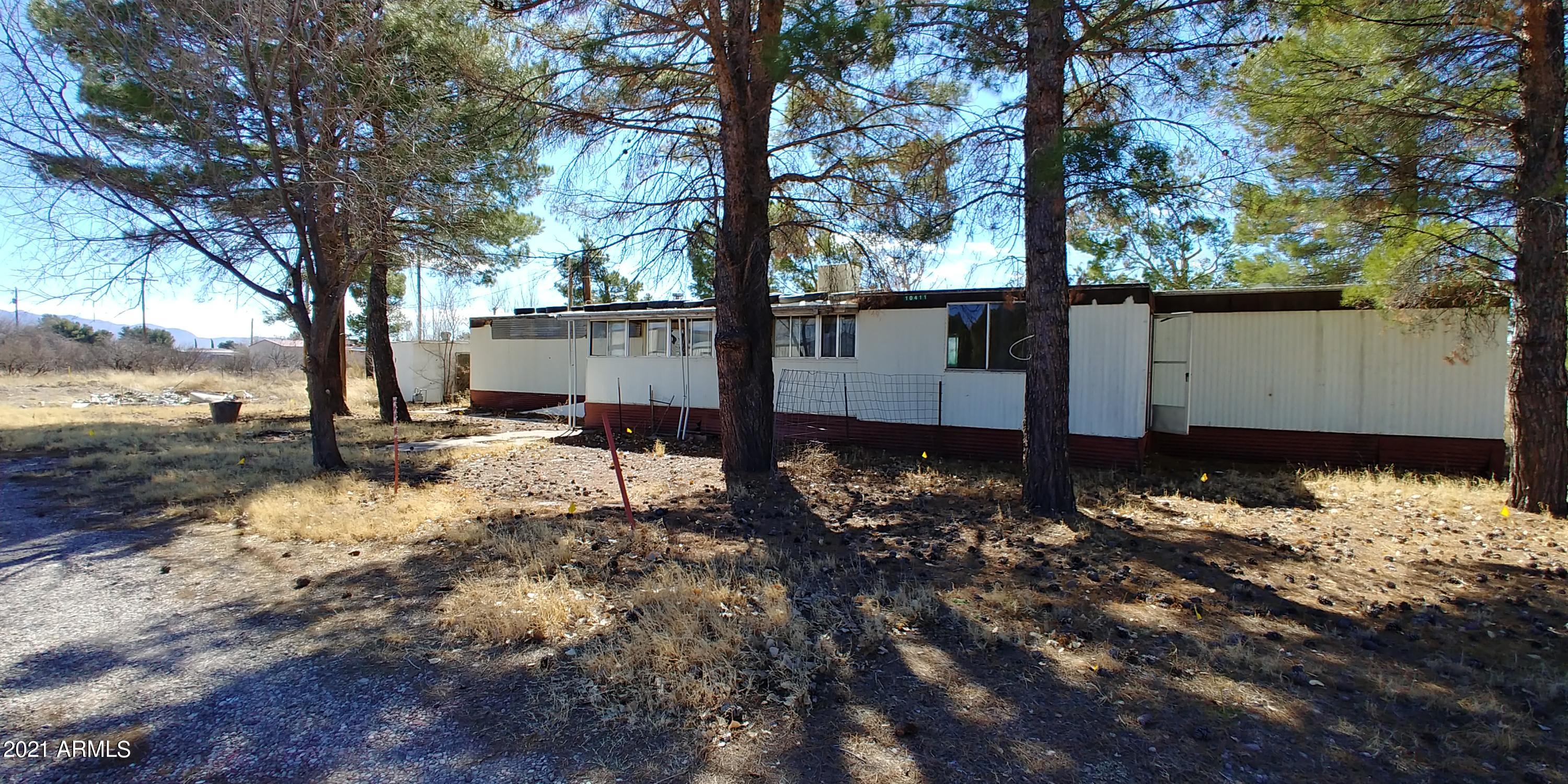 This property is within walking distance to most of what you would need. There are big pine trees and the property is partially fenced. The house is a fixer but could be fixed up. This is an AS IS sale. The seller does not pay for ANY costs including septic, escrow, title insurance etc. Please allow at least 72 busines hours for a response of your offer.