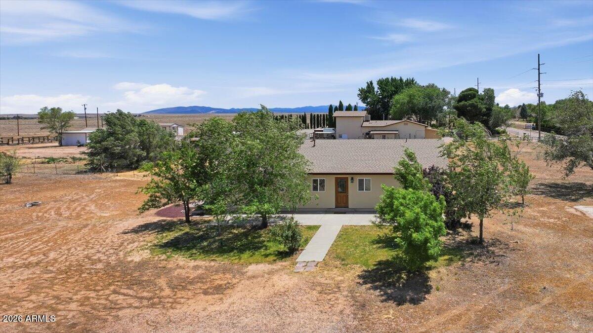 ust like new! This beautifully remodeled 3-bedroom, 2-bath home sits on over 2 prime acres in the heart of Chino Valley. The bright and inviting kitchen features abundant counter space, thoughtfully designed cabinetry, and newer stainless-steel appliances. Enjoy the convenience of a detached 5-car garage with drive-through access, offering ample room for vehicles, toys, hobbies, or a workshop. Perfect for horse enthusiasts, the fully usable acreage provides plenty of space for animals, equipment, and outdoor living. Back property is fully fenced. Major upgrades include a new well, new roof, new windows, and numerous additional improvements throughout the property. A large storage shed and 20-foot shipping container provide even more room for tools, equipment, and storage needs. Conveniently located with quick access to Highway 89, making commuting to Prescott, Prescott Valley, and surrounding areas a breeze. Don't miss this move-in-ready property that combines modern updates, acreage, and endless possibilities.