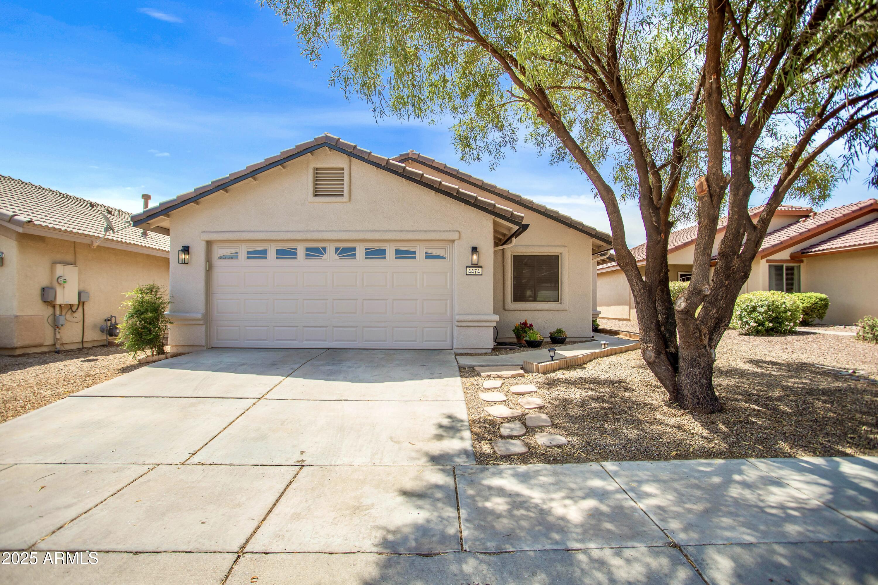Tucked away in the sought-after Holiday subdivision, this beautifully maintained 3-bedroom, 2-bathroom home with a 2-car garage offers comfort, style, and convenience. Step inside to discover vaulted ceilings, a cozy fireplace in the living room, and a spacious layout perfect for everyday living or entertaining. Take in the mountain views from the private backyard which features a charming gazebo—ideal for relaxing or hosting gatherings.  Lush greenery to add to that retreat vibe! Additional highlights include epoxy garage floors, fresh exterior paint, high end security doors and true move-in readiness. Enjoy all that the Holiday community has to offer, including multiple swimming pools, a relaxing spa, clubhouse, walking paths, playgrounds, and more!
