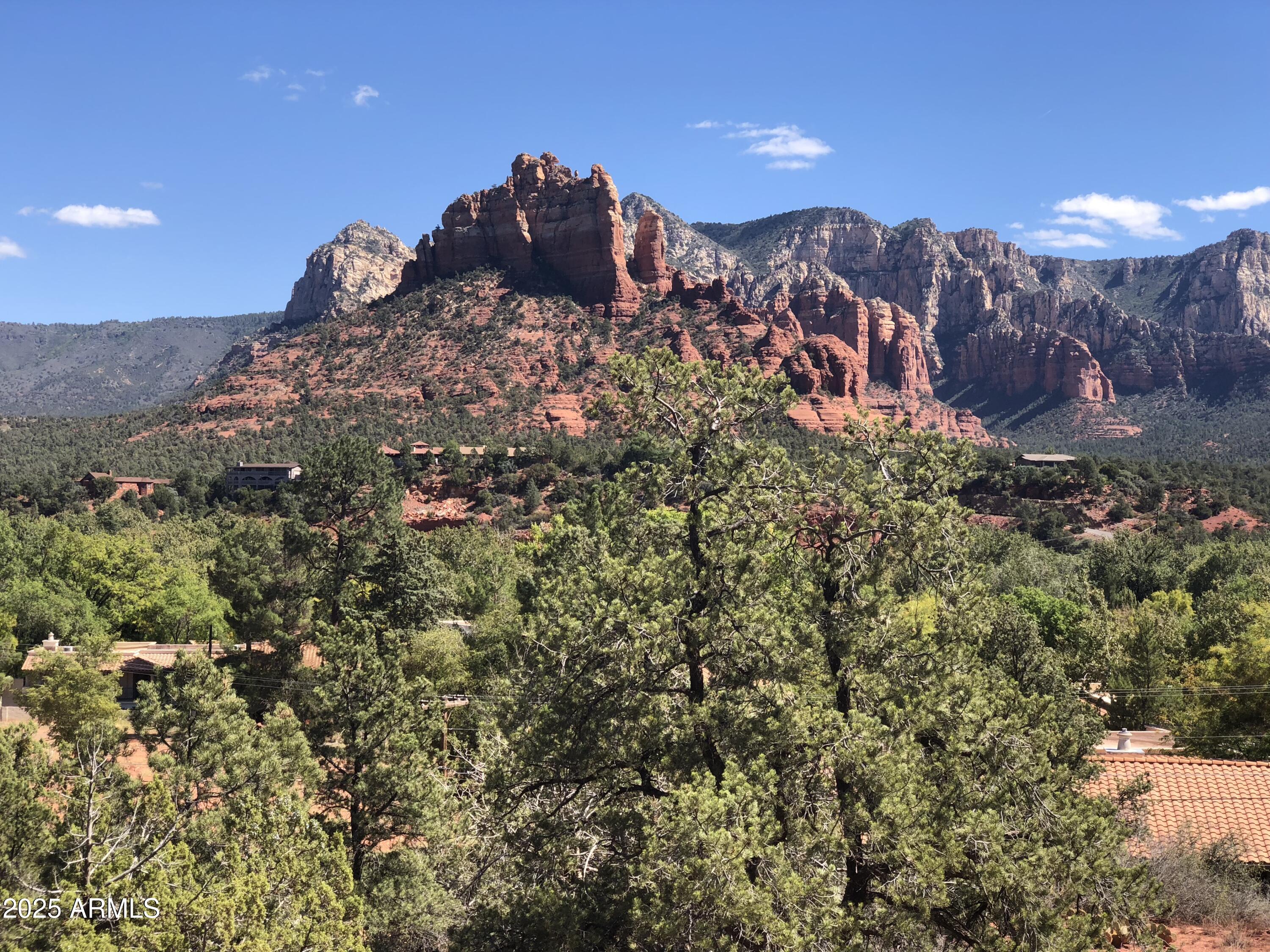 Sky Ridge Estates is Sedona's newest subdivision/residence club in the heart of Sedona. This lot is among the top/best 6 of 19 high up on ridge at the end of the cul-de-sac with 360 degree views. This beautiful panoramic view hilltop lot is discounted for a limited time until the road & underground utilities are completed . Short walk to new town square/city park and museum, Tlaquepaque, high-end shopping and dining, Los Abrigados Spa resort, restaurants, gym, lit tennis and pickleball courts, Oak Creek front park available for membership. Road & underground utilities to be completed by late 2026 This is a residence club lot meaning within a 24 hr secured, to be gated subdivision with adjoining clubhouse with anti aging spa and amenities, offering 5 star property management(not airbnb) , room service etc. 

Very quiet and secluded, yet in the heart of Sedona, with a 10 walkability score. Walk to Town Square , tlaquepaki , 10 restaurants 

Build Your Dream: Opt for our innovative rustic contemporary, metal, and ceiling-to-floor glass eco-friendly landscape homes, designed for efficiency and elegance. Cantilevered on pillars etc See renderings under the photo tab.

Unparalleled Views, Privacy, very quiet & secluded:

19 Total Exclusive Lots. 9 sold, 3 pending (at 995,000), 6 remaining. Each average half-acre lot offers breathtaking panoramic views along a serene, quiet ridge,  through  hidden canyon.

*Infrastructure is underway, roads and utilities are being installed with completion scheduled for mid 2026.

Collaborate with our top architect and builder to bring your vision to life. Contact us for more details on this unique opportunity.
Most recently sold lot comp lots in residence clubs);
1.)60 Indian head lane .54 acre lot 1/15/2024 sold for 1,250,000.
2.)170 HIDDEN MEADOW DR 7, 1.3-acre lot 3/26/2025 sold for 3,100,000
3.)75 PASEO DEL INEZ 7; 81-acre lot 1/13/2026 sold for 1,350,000.
*(gates and clubhouse pending plans approval, clubhouse is not part of subdivision)