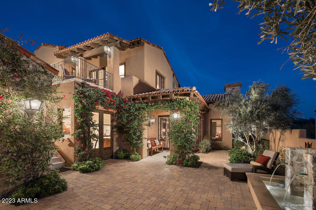Nestled in the highly sought-after Casita neighborhood in Silverleaf, this property is located on a premium view lot just one block from the Clubhouse. Interior styling is timeless, a thoughtful combination of transitional and classic.  Interior features include new Wolf appliances, updated custom light fixtures, new Crestron whole home automation system, travertine and wood floors throughout, warm wood beam ceilings, and elegant crown moldings with current wall color palette. Dramatic mountain views are captured from the back, including a unique perspective of the Silverleaf Clubhouse from the 2nd floor balcony.  The floorplan includes oversized kitchen/great room, bar, gracious master bedroom, powder room and separate entry guest casita on the main floor. The second floor includes a large bonus room and adjacent den/media room with full bathroom, wine room, plus a junior master suite with private balcony. The intimate backyard includes large covered patio, outdoor speakers, elegant pool and spa, BBQ area and private fireplace patio all soaking in McDowell Mountain views. Furniture can be available via separate bill of sale. The Casita neighborhood is renowned for its timeless architecture, smart floorplans and proximity to the Silverleaf clubhouse. Easy access from the Horseshoe Canyon gate and adjacent hiking trails- and just minutes from area shopping /dining and Loop 101.