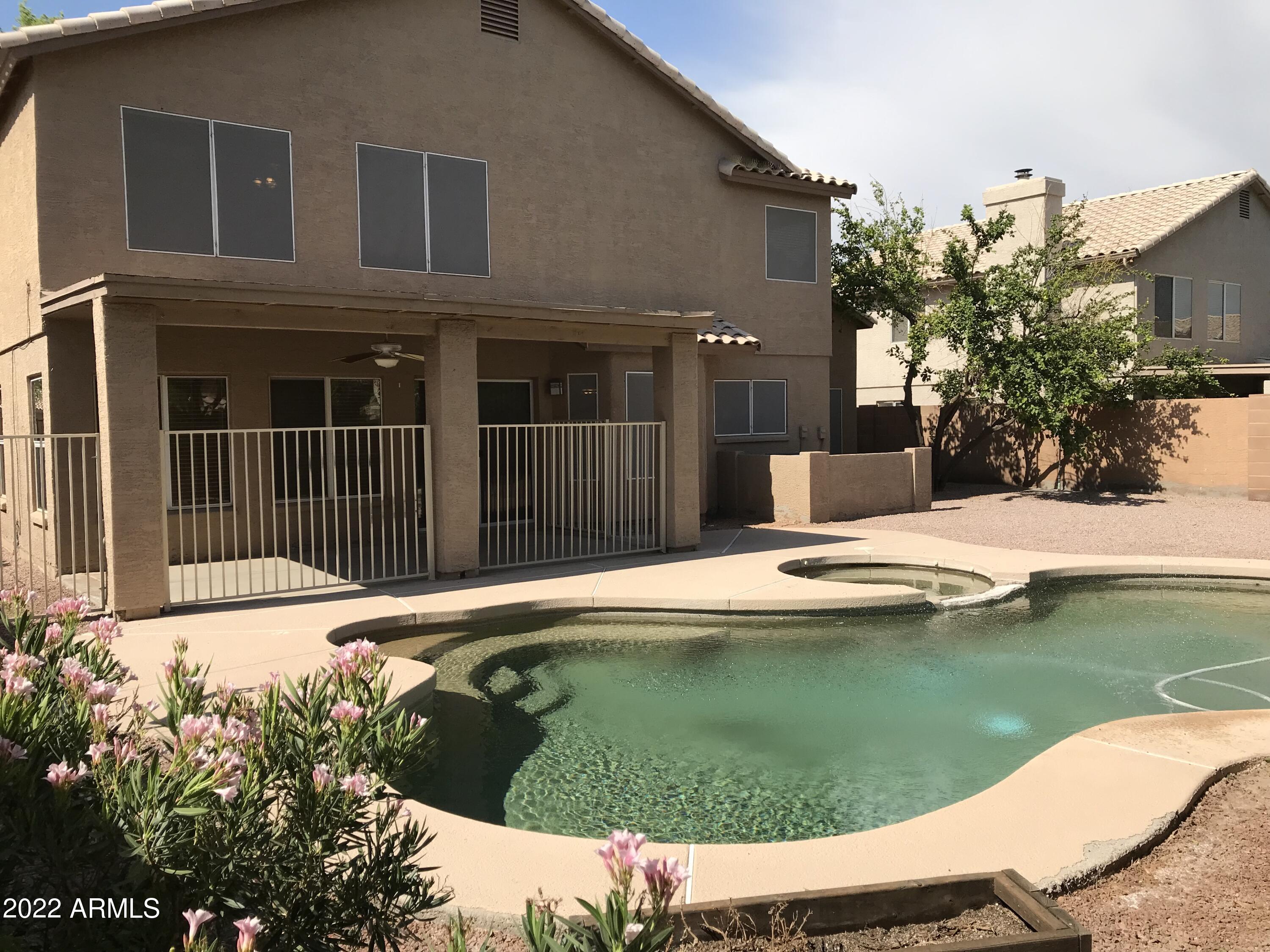 5 Bedrooms | 2.75 Bathrooms | 17x10 Den. Located in a highly desirable Gilbert neighborhood, this spacious home features a sparkling fenced Pebble Tec pool and an inviting layout with vaulted ceilings, ceiling fans, and a blend of carpet and tile in all the right places. The eat-in kitchen offers a bay window and center island, perfect for everyday living and entertaining. The primary suite includes double sinks with separate vanities, a garden tub, and a step-in shower. Enjoy both a separate living room and family room, plus a large covered patio ideal for outdoor relaxation. Pool Service is Included. Renters insurance required. INCLUDES: Range/Oven, Dishwasher, Fridge, Garbage Disposal, Microwave - Washer/Dryer Hook Ups Only.