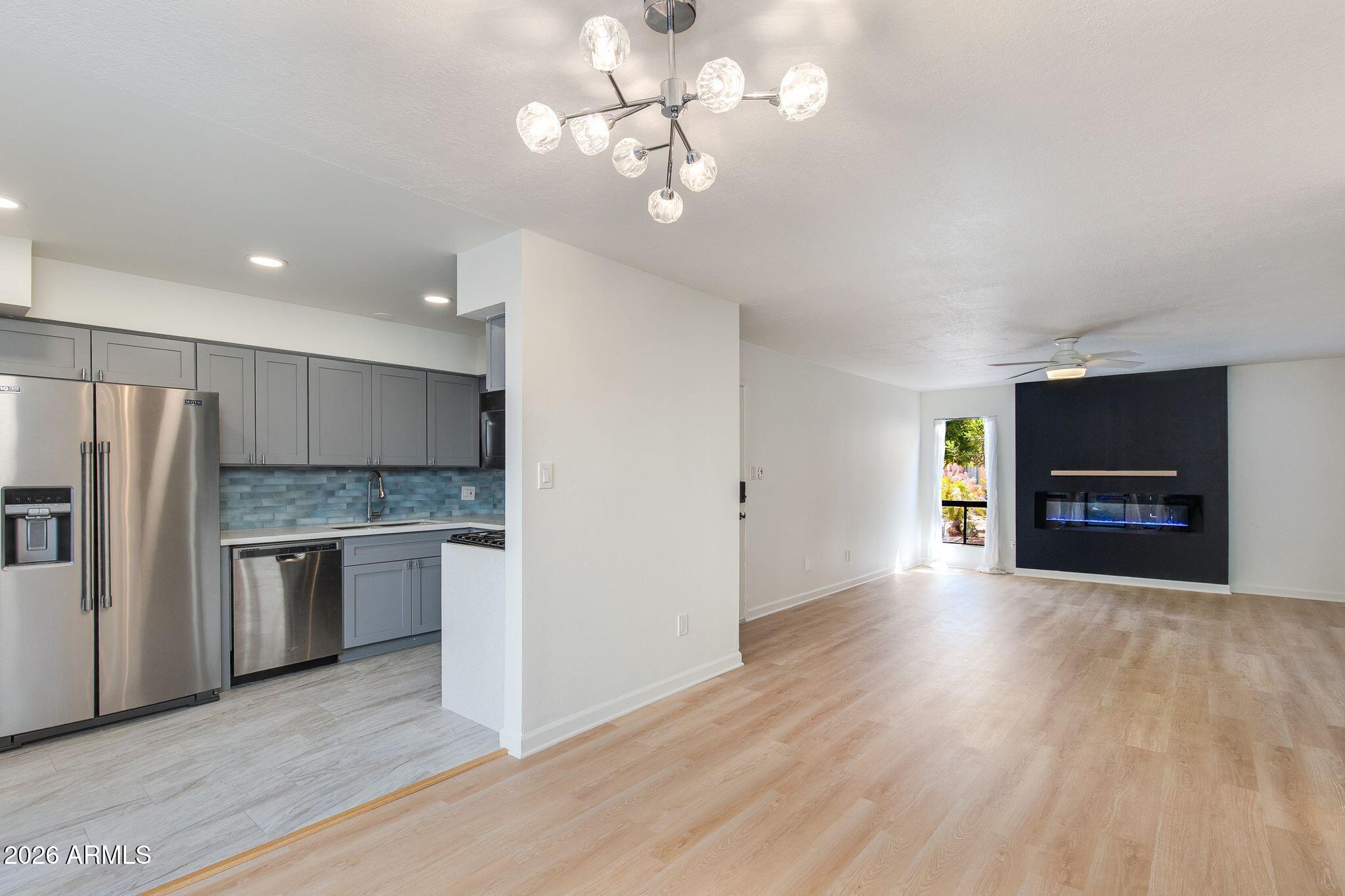 Welcome home to your charming ground-floor condo positioned in one of the best locations in Old Town Scottsdale. Newly renovated with vinyl plank wood flooring, full master bathroom renovation, and more. HOA fee includes ALL utilities (electric with no cap, W/S/T, gas). Whether you're looking for a primary home, lock n' leave, or investment rental, look no further. Featuring SS appliances, gas range, and a shaded patio with storage/in-unit laundry. Walking distance from the best of Old Town shopping, nightlife, and restaurants! Not a spot was missed in this fully turnkey, low maintenance unit positioned just steps from the community pool.