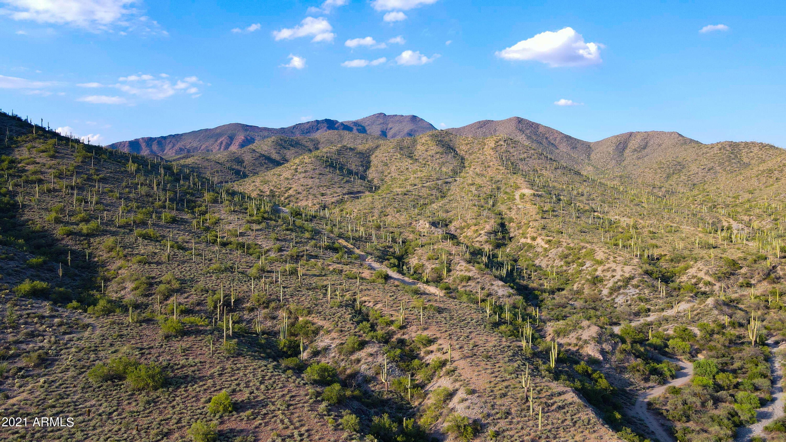 Rare 56-Acre Cave Creek Sanctuary - Level Land Meets Mountainside Views!
Discover a one-of-a-kind 56-acre property in Cave Creek, Arizona, offering both level land and dramatic mountain terrain - at the scenic Mexican Hat, ideal for hiking or building a custom hillside home with panoramic views. This exceptional parcel provides endless possibilities: create a private luxury estate, equestrian ranch, or peaceful family compound surrounded by the beauty of the Sonoran Desert. Enjoy space for horses, guest homes, or outbuildings, along with unforgettable sunsets, city lights, and starlit nights. Perfectly positioned between the charming towns of Carefree and Cave Creek, you're minutes from dining, art, and shopping, and and only 45 minutes to the airport. This property combines privacy, nature, and convenience, making it an unparalleled opportunity for Arizona land buyers seeking both beauty and potential.