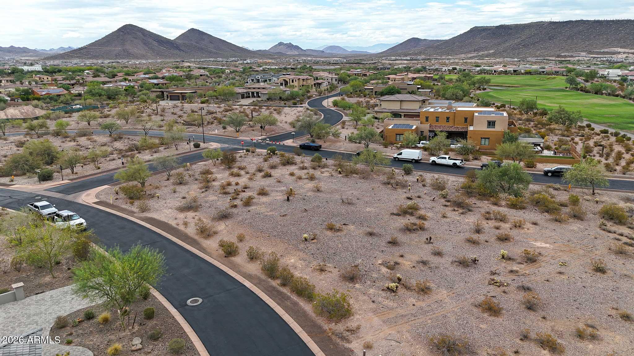 Presenting a great opportunity to own a premier golf course home site within the exclusive gates of Blackstone Country Club. Perfectly positioned along the manicured fairways, this exceptional corner lot captures sweeping views of the greens, stunning desert landscapes, and breathtaking Arizona sunsets, providing an unparalleled setting for a custom luxury estate. It's surrounded by upscale custom homes and world-class amenities, this home site offers the ideal balance of elegance, and natural beauty. Whether you envision a modern masterpiece or a timeless desert retreat, this property provides the perfect canvas to bring your vision to life. Don't miss this chance to secure one of the area's most desirable golf course home sites in this prestigious community.