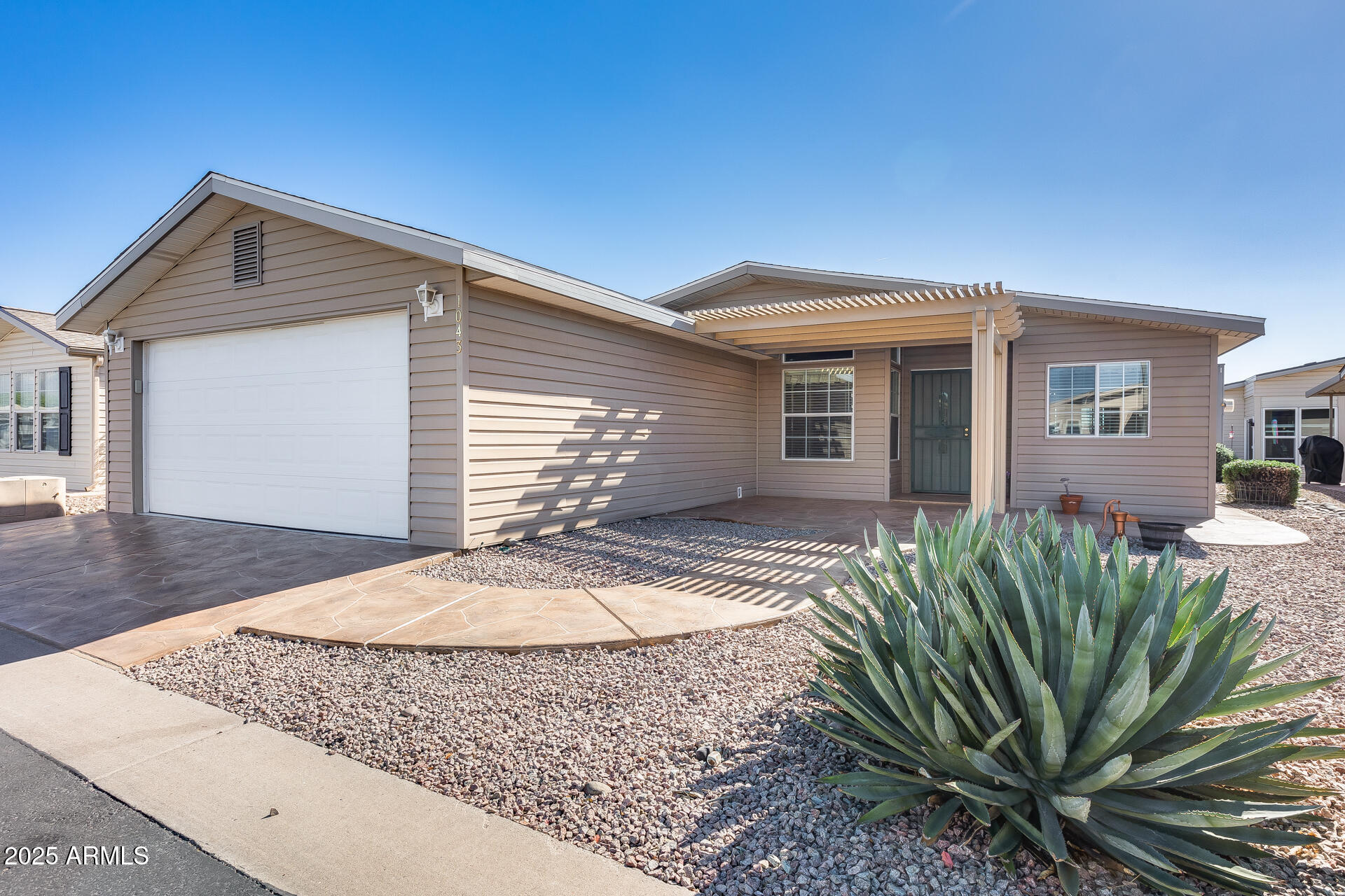 MOTIVATED SELLER•AFFORDABLE•MOVE IN READY•GREAT VALUE! Seller concession possible with acceptable offer. Move-in ready 2 bed, 2 bath home in Dolce Vita adult community featuring a  split floor plan, private primary suite with dual sinks & walk-in closet, plus an office/den with built-in computer nook. Light-filled living with skylights, fresh neutral paint, tile in main areas, & a beautiful stained glass window adding character. Open kitchen & great room ideal for everyday living & entertaining. Enjoy the enclosed AZ room.  Exterior features: front pergola, stamped driveway/walkway, & a 2-car garage. Community amenities: heated pool/spa, clubhouse, pickleball, fitness center, & social calendar.