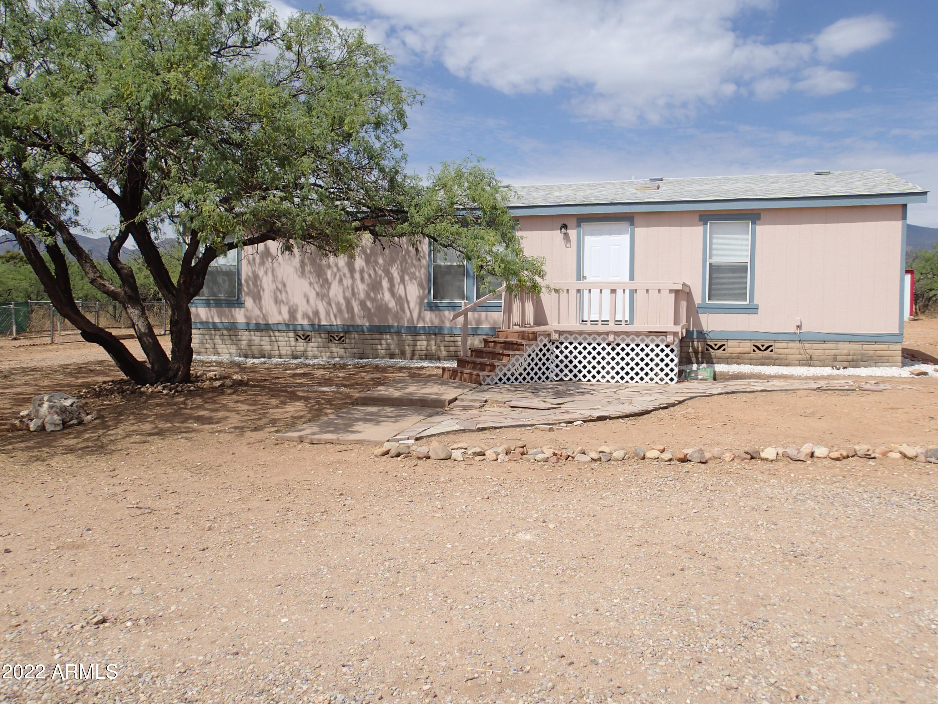 SECLUDED 4 Acres with large Mesquite Trees and unobstructed Mountain Views.   Private graveled drive at end of Road only 15 minutes to town.  Circle gravel Driveway with Horse/Animal area. This Split Plan 3 bedroom, 2 Bath, 1456sqft home has alot to offer. New Carpet, Ceiling fans, Bathroom light fixtures and Dishwasher. Roof, Exterior paint and AC done in 2020.  Good size bedrooms both with Walk-In Closets. Main Bedroom has large double door closet and bathroom with Garden tub and Linen closet. Kitchen features an Island and Desk Area, plus open Dining space. VA Block Foundation. Fenced Dog Run/Pens.  Firepit Area. Plenty room for RV parking. Storage Sheds. Comes with owned 250 Gallon Propane Tank. This home will not last!!! Come and See before it's gone!!!