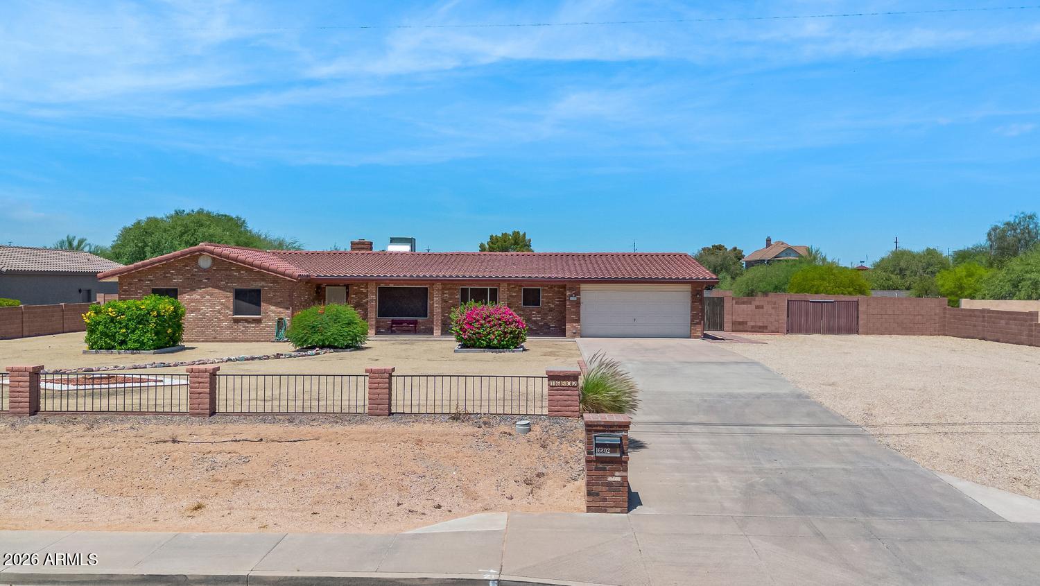 Rare opportunity to own a sprawling horse property on over 42,000 sq ft with no HOA in a desirable North Phoenix location. This well-built block construction home offers 3 bedrooms, 2.5 bathrooms, spacious living areas, and timeless charm with a cozy brick fireplace. The expansive lot provides endless possibilities for horses, RVs, trailers, toys, or future improvements. Property features an RV gate and two detached workshops, including a 473 sq ft shop with electricity, plumbing, sink, and toilet--ideal for hobbies, projects, storage, or a home-based business. A second 118 sq ft workshop provides additional flexible space. Enjoy privacy, room to grow, and the freedom that comes with acreage living while remaining close to shopping, dining, parks, and freeway access.