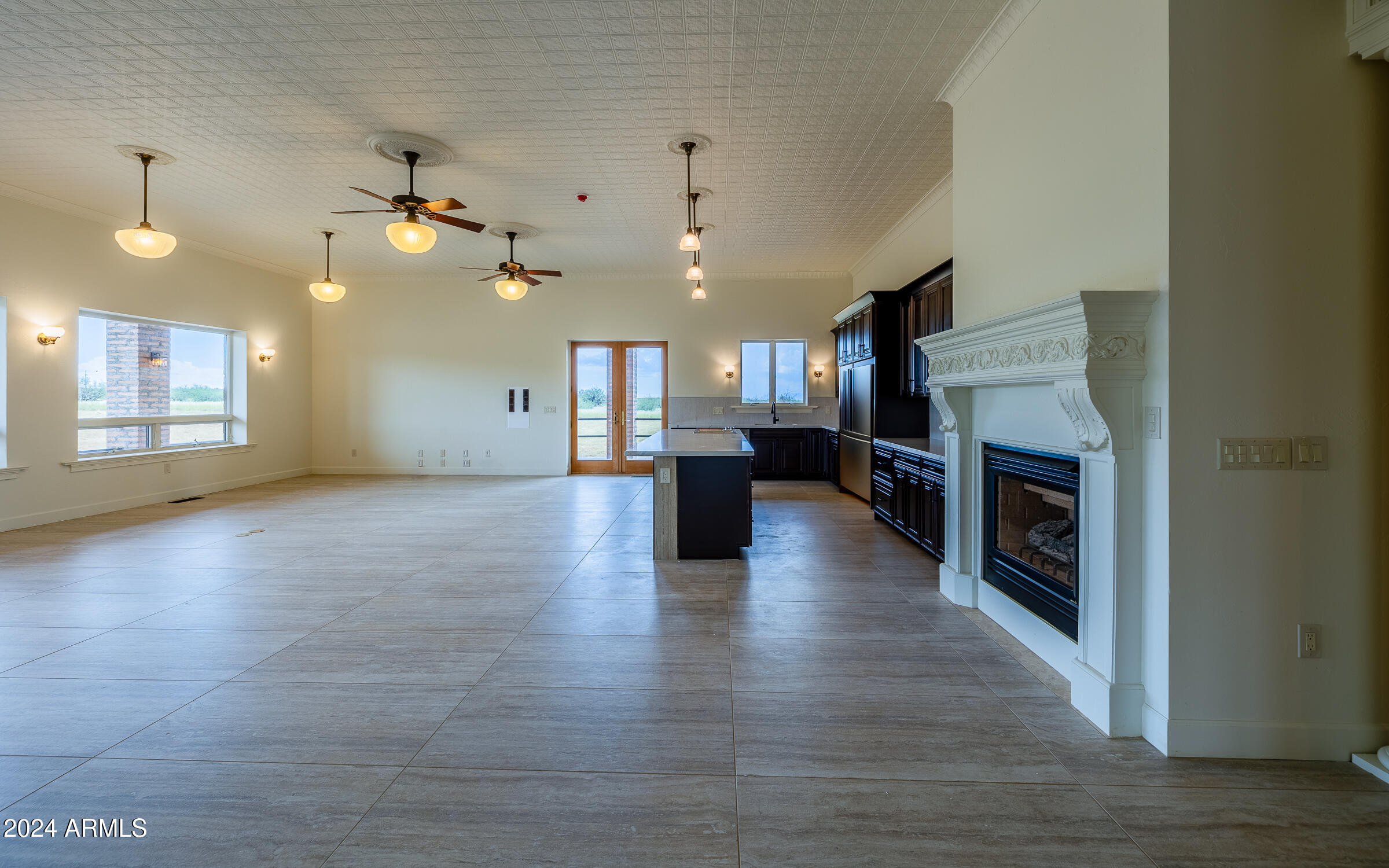 Discover a unique gem in Dragoon Mountain Ranch with this expansive ranch house spanning over 4,300 sq. ft. on 36 acres. This gated estate features 3 bedrooms, 2 bathrooms, and robust block and steel construction. Enjoy exceptional amenities, including a personal pub for entertaining and an indoor shooting range with walk-in gun safe rom for enthusiasts. The wrap-around porches offer stunning views and a perfect spot to relax. Experience the ultimate in privacy and comfort in this sought-after community. Also includes a huge 3 car garage with work shop, private well, full RV hookups. The property is fenced with a secondary powered private gate. Includes 1200 sqft of covered patio and over 1200 sqft of garage space. This one is a must see!!! Owner agent