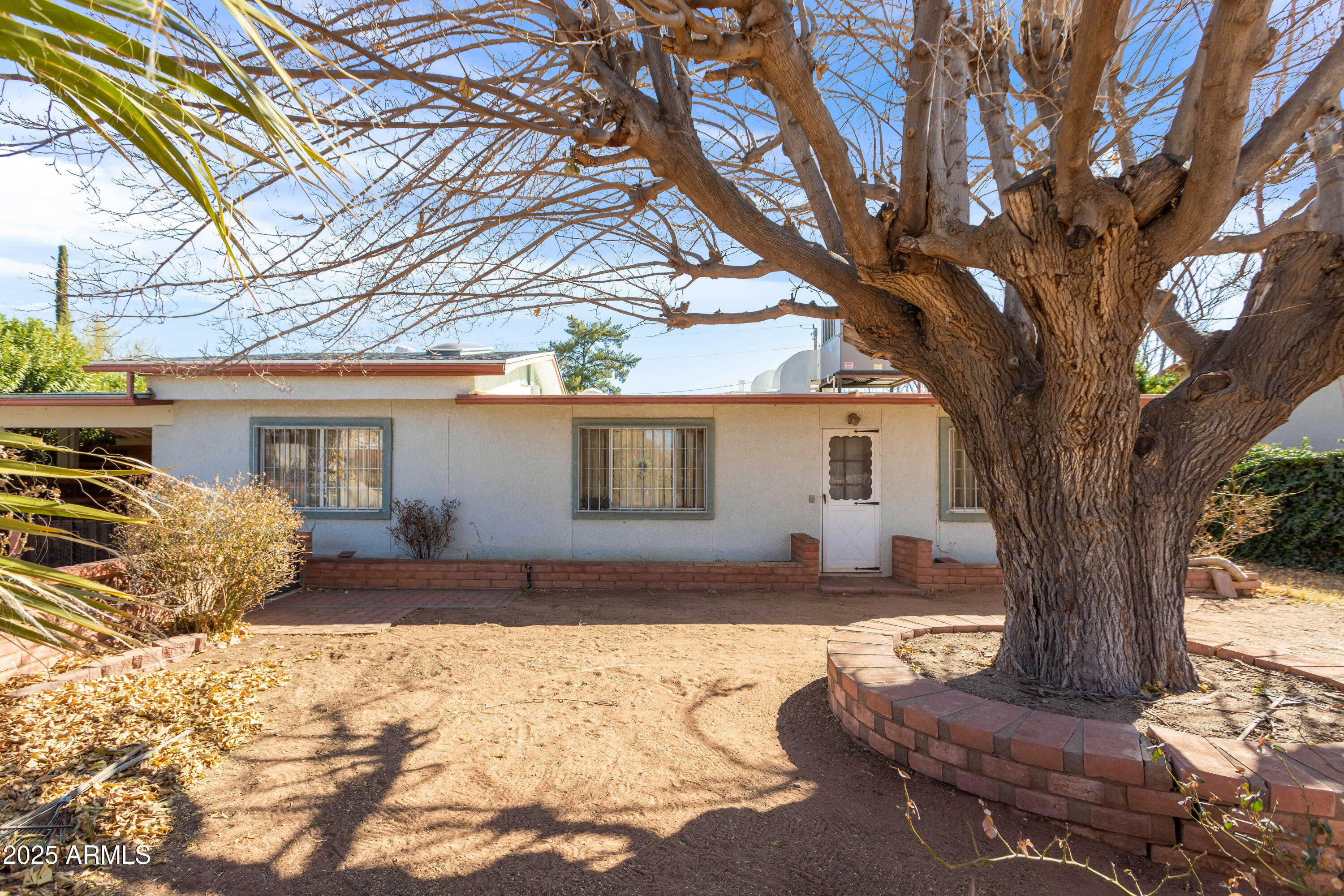 Sweet gem of a house on the west side!  Includes a large kitchen with gorgeous wood cabinets and a huge breakfast bar, separate dining area and room for your office.  Wouldn't take much to make the entire back of the house a master suite.  Extra large shed in backyard for that workshop you've always wanted!