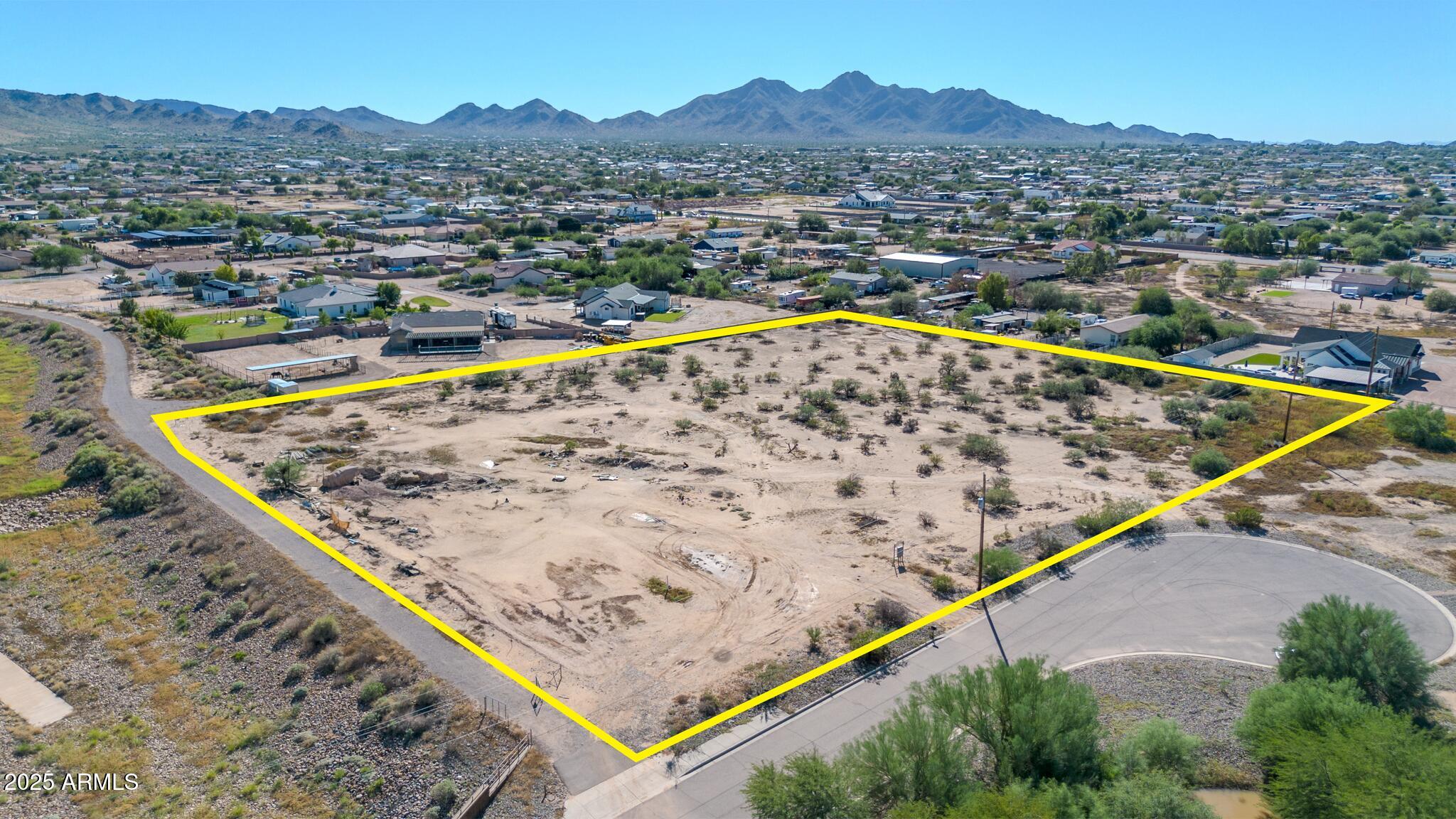 Imagine building your dream home on this beautiful 3.85-acre property! Endless design possibilities, keep the entire parcel or consider a minor land division for up to 3 lots (buyer to verify). A 2018 single-wide Mfg/Mobile home is attached to a foundation, making it easier to finance. This property is located within walking distance of the Horseshoe Park & Equestrian Centre on Riggs Rd.  No HOA. Minutes from shopping, dining, and East Valley favorites like the Queen Creek Olive Mill and Pecan Lake Entertainment. A great opportunity for a small builder, investor, or anyone looking for acreage with lifestyle appeal!