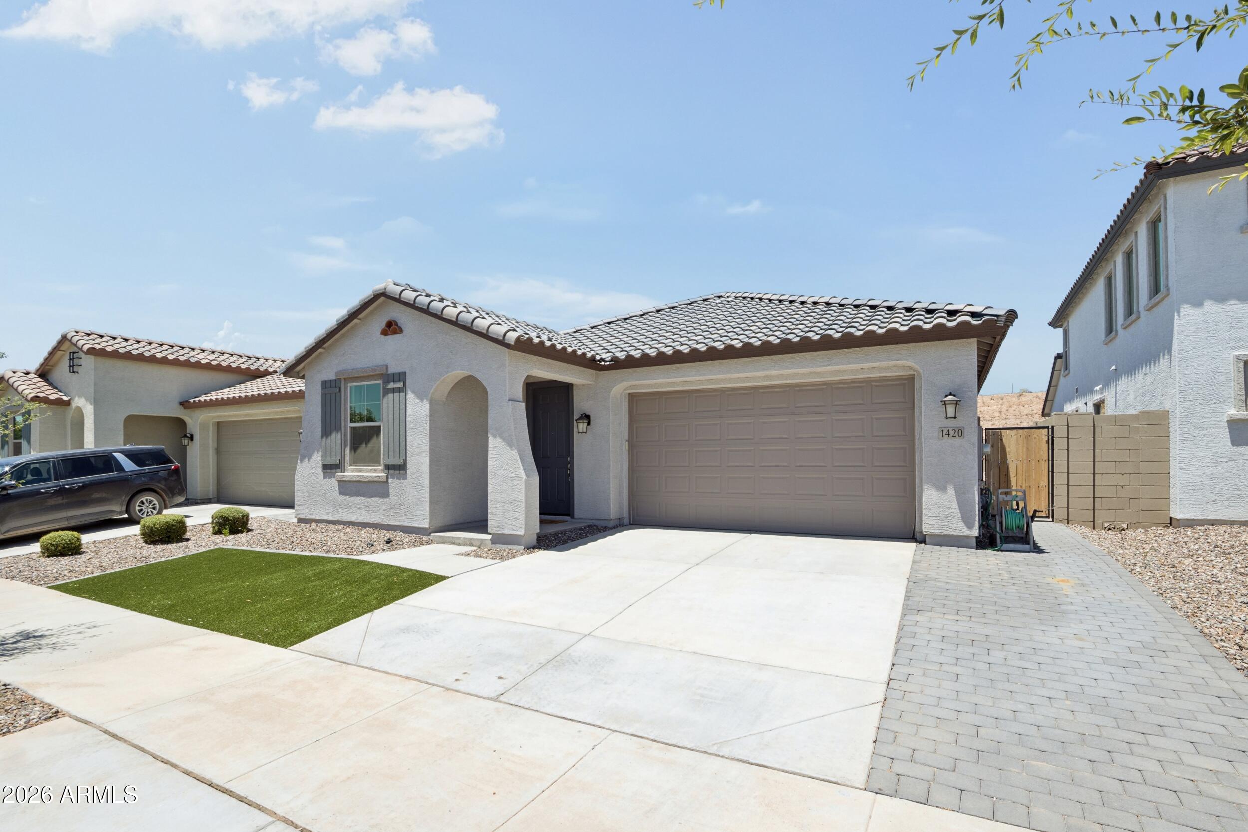 Why wait months for new construction?! When this move in ready home is available now?! Located in one of the area's desirable new build communities, this beautifully upgraded single story home offers all the benefits of new construction without the wait. This home features an impressive list of upgrades throughout, including an air-conditioned garage, a tankless water heater, an extended driveway, low maintenance backyard with turf and beautiful pavers throughout. Every detail has been carefully considered, making this home truly better than new. With this new home you will also enjoy access to the community's recreation center featuring a sparkling pool and gathering spaces, providing the perfect place to relax, stay active, and connect with neighbors.