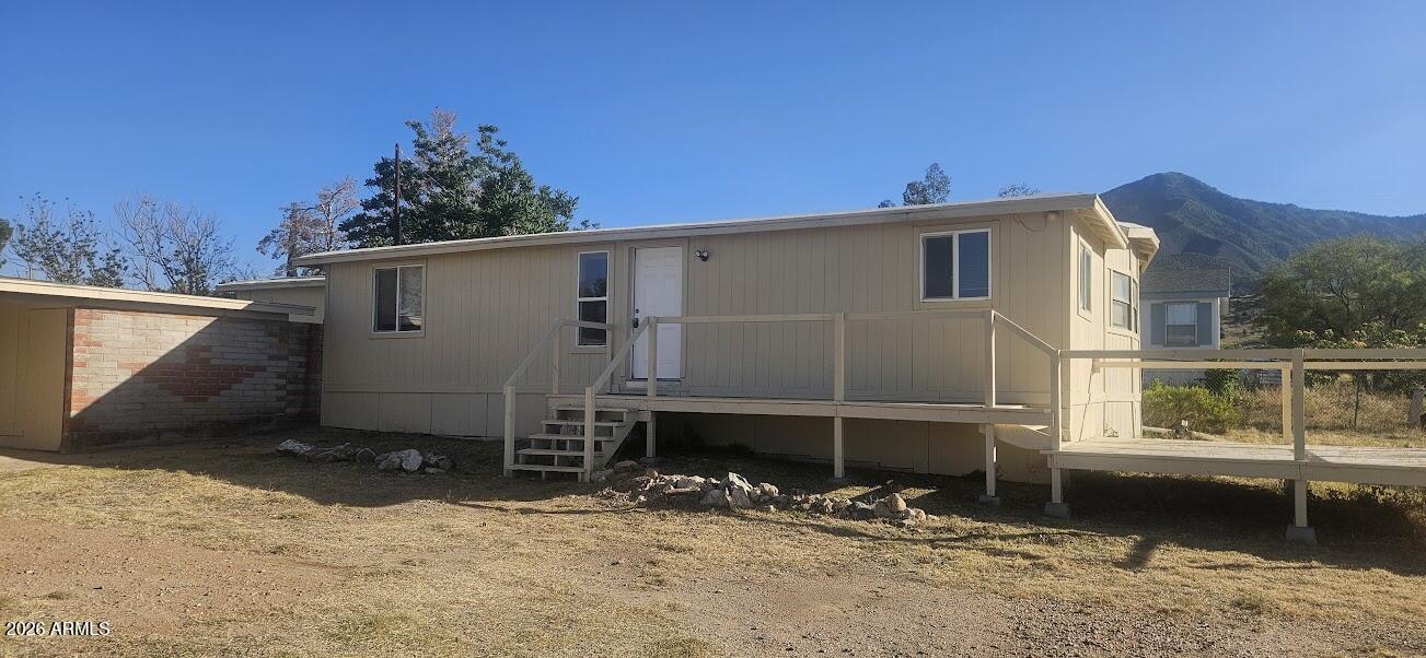 nicely remodeled 4-bedroom 2 bath home with mountain views.  The home has a large yard that is fully enclosed with a block wall and there is a large site-built workshop for great for projects or storage.  The interior of the home has a split floorplan with large, remodeled kitchen and bathrooms.  Verge large living space with both a family room and living room provide spacious areas for the family.  New flooring and fixture throughout the home make this a turnkey opportunity at a great price.