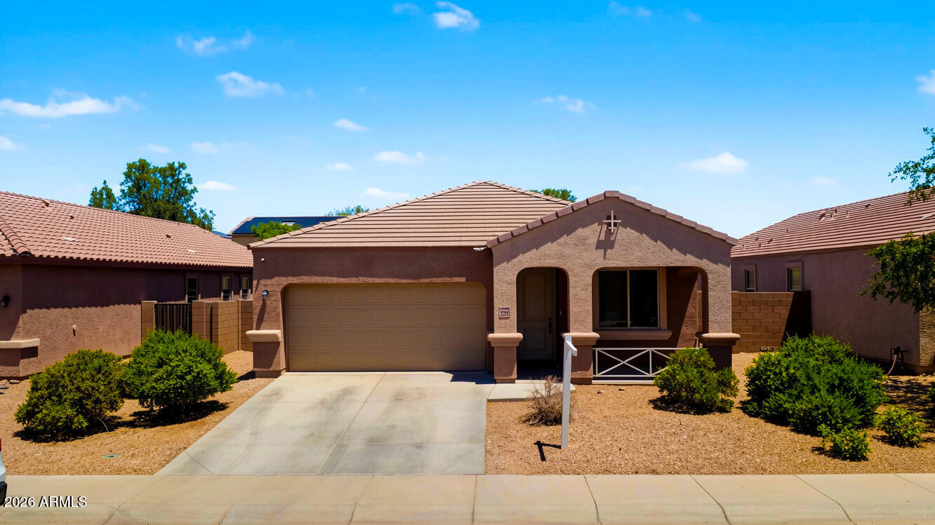 A single-level home in Sonoran Vista with the kind of layout buyers are usually trying to find in this price range: 4 bedrooms, a separate den, 2.5 bathrooms, and 1,855 sq ft of living space. The main living area brings the kitchen, dining, and great room together, while the den gives you a true flex space away from the bedrooms. The primary suite includes a walk-in closet, full bathroom, and private toilet room. The home also includes  solar, a covered patio, block-fenced backyard, desert front landscaping, and a 2-car garage. Conveniently located  with access to nearby schools, shopping, dining, and Buckeye's continued grow