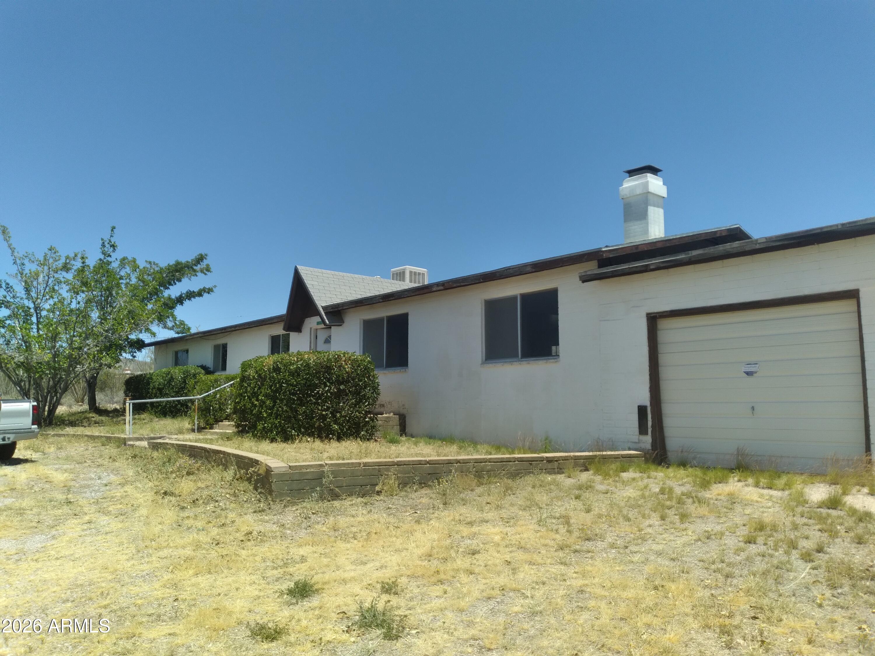 Nearly 1 acre with breathtaking 360-degree views, this 3/2 offers incredible potential and the flexibility to easily function as a 4-bedroom. With solid bones and mostly cosmetic updates needed, it's the perfect opportunity to create your dream property, investment, or desert retreat.
Major improvements have already been completed, including a brand-new electric panel and wiring,  and a NEW never-used septic system with receipts available--see documents for details. The spacious lot provides endless possibilities for outdoor living, RV parking, workshops, animals, or expansion. 1 car garage, would make a nice large workshop.  Plenty of parking in circular driveway.
Bring your vision and unlock the massive potential this property has to offer.  Cash only,