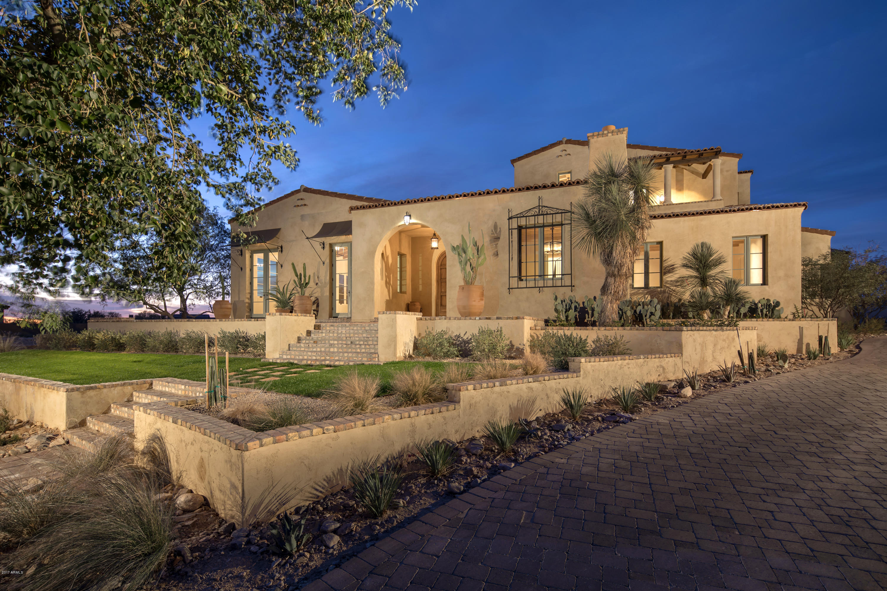 The best of Silverleaf.  Authentic and charming, this magnificent Spanish Revival custom estate is the result of the superb craftsmanship of builder Eric Linthicum of Linthicum Custom Builders, and architect Gene Kniaz of Spiral Architects. This home features traditional Spanish contemporary influences including three coat exterior plaster as well as hand plaster interior walls.  Quality finishes throughout compatible with Santa Barbara Spanish style architecture including handmade tiles, wood floors, beam ceilings and hand painted windows.  Unique features include gourmet kitchen with well-appointed butlers pantry, master suite that opens to an outdoor courtyard with fireplace, spa & private patio shower and separate guesthouse.  Outdoor entertaining is easy with a pool cabana, generous covered patios, old growth ironwood trees and massive saguaros that surround the classically styled pool and spa. Situated on a private homesite bordering open space in the Arcadia neighborhood of Silverleaf.