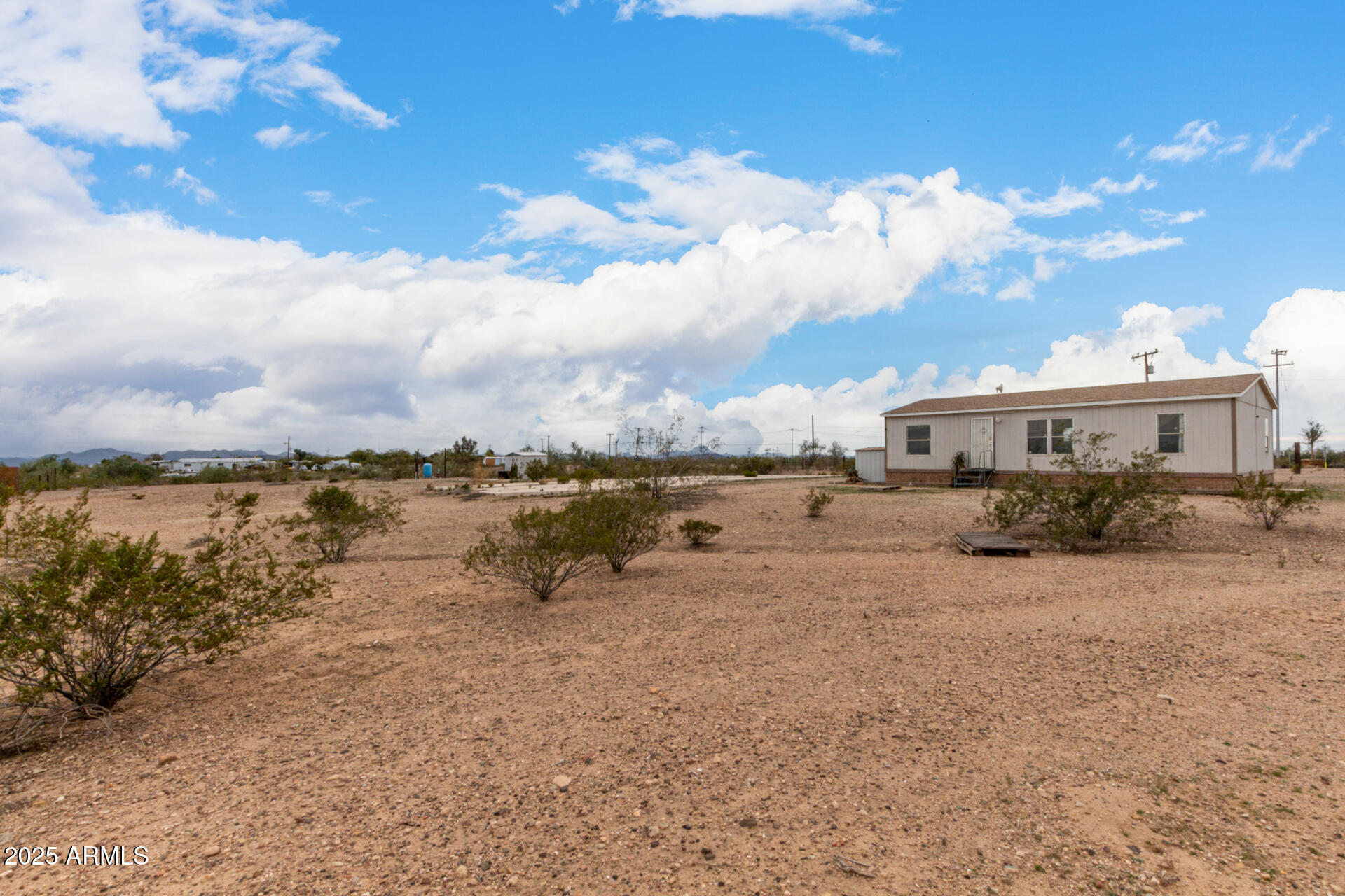 Fantastic opportunity to own this HUGE 9-acre horse property with tons of possibilities! The charming manufactured home offers 3 beds & 2 baths. Discover an inviting interior showcasing a welcoming living room, abundant natural light, vaulted ceilings, neutral palette, and wood-look flooring t/out. The eat-in kitchen boasts SS appliances, ample wood cabinetry, a pantry, and a built-in desk. The main bedroom has a walk-in closet & a full bathroom for added comfort. Check out the expansive yard with so much potential! The storage sheds ensure tools are organized. There are also two RV gates, along w/large cement slab that is perfect for multiple vehicles or outdoor seating. Ideal for horse enthusiasts and for all your off-road toys. Enjoy the mountain views! No HOA! A RARE find awaits you!