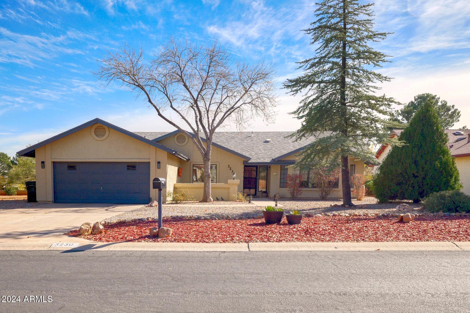 Spacious 3-bedroom, 2-bath home on a large golf course lot with stunning mountain views and no HOA! Recently updated with new interior paint, carpet, vinyl plank flooring, and room-darkening shades. The kitchen features new Samsung Bespoke appliances, an induction range, and butcher block countertops. Bathrooms include new vanities and toilets. LED lighting and fans throughout provide energy efficiency and comfort. Stay cool with mini-splits and new AC. Relax on the stamped concrete patio. Oversized garage and newer roof complete this move-in-ready home!