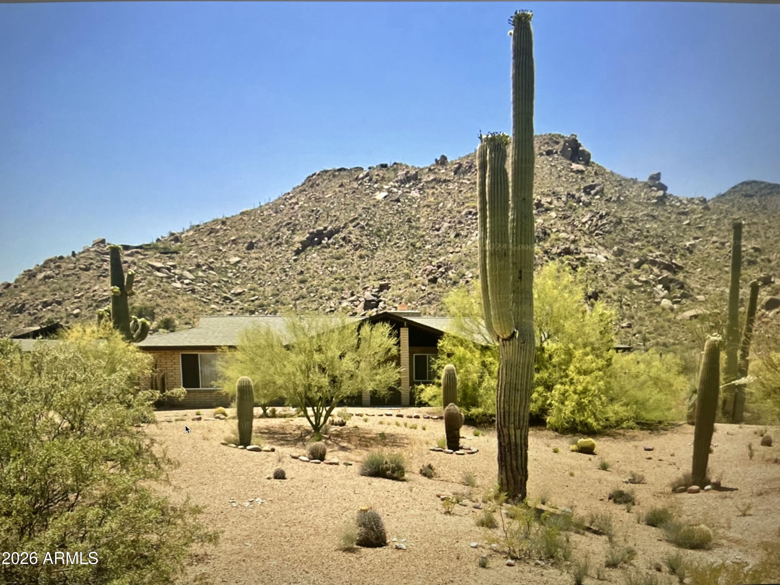You will find this home in a beautiful location at the base of Black Mountain's NE side.  Sitting slightly higher than the street, the large window at the front of the home has a panoramic view of mountains to the north and the dining room window faces Black Mountain to the SW. This slump block Ranch home has 3 bedrooms, 2.5 baths and a 3 car garage.  It needs some TLC to make it yours.  Being in the heart of Carefree offers grocery shopping, quaint shops and an abundance of restaurants in the area plus the Carefree Sundial; a must-see for visitors.