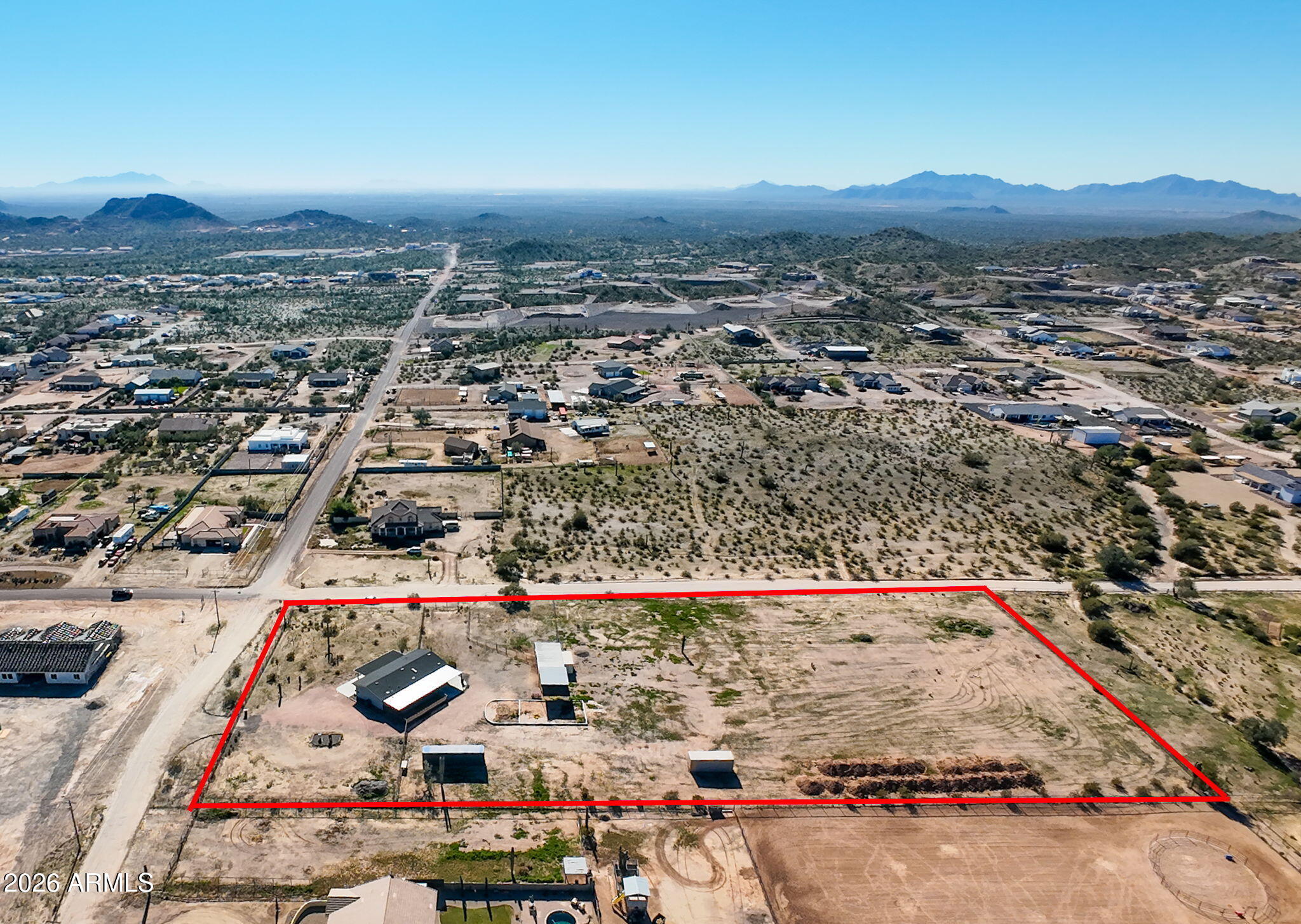 ***OFF THE GRID-  CHANDLER HEIGHTS RANCHES -- RARE 5-ACRE HORSE PROPERTY WITH ENDLESS POSSIBILITIES! Perched on a corner lot overlooking surrounding properties, this updated ranch-style manufactured home offers breathtaking 180-degree mountain views, including the Superstition Mountains, and the peaceful Arizona lifestyle you've been dreaming of. With 218,004 square feet of land, this property delivers space, privacy, freedom, and incredible versatility. Featuring 3 bedrooms, 2 bathrooms, a split floor plan, spacious great room, dining area, and separate laundry room, the home is designed for comfortable everyday living. Enjoy the charming covered front porch, huge covered back patio, and endless desert sunsets right from your own hilltop retreat. The expansive acreage is ready for horses, livestock, chickens, RVs, boats, trailers, equipment, gardens, and more. Existing improvements include a chicken coop, storage building, private well (not shared), and wide-open areas perfect for riding arenas, rodeo grounds, additional garages, workshops, casitas, or even future homes. Whether you're looking to create a private homestead, multi-generational property, equestrian setup, or off-grid lifestyle, the opportunities here are truly endless.

Inside, the bright kitchen offers modern appliances, ample cabinetry, generous counter space, pantry storage, and a functional layout ideal for entertaining. The spacious primary suite features dual sinks, soaking tub, walk-in shower, private toilet room, and walk-in closet. Additional bedrooms are thoughtfully separated from the primary suite, providing flexibility for guests, family, or a home office.

Located in a peaceful rural setting with quick access to Hunt Highway, Ellsworth Road, Queen Creek Marketplace, dining, shopping, equestrian trails, outdoor recreation, and Loop 202.

Recent upgrades include: Windows & Doors (2022/2023), Flooring (2023), HVAC (2023), Guest Bath (2024), Porch & Concrete (2024), Exterior Paint (2024), Roof (2025), Full Primary Bath Remodel (2025), Septic Service (2025), Back Patio Shades (2025), Laundry Room (2025), Electrical Receptacles (2025), Well Pressure Tank (2025), and Interior Paint (2025).

Bring your horses, livestock, toys, and vision -- properties like this are hard to find!