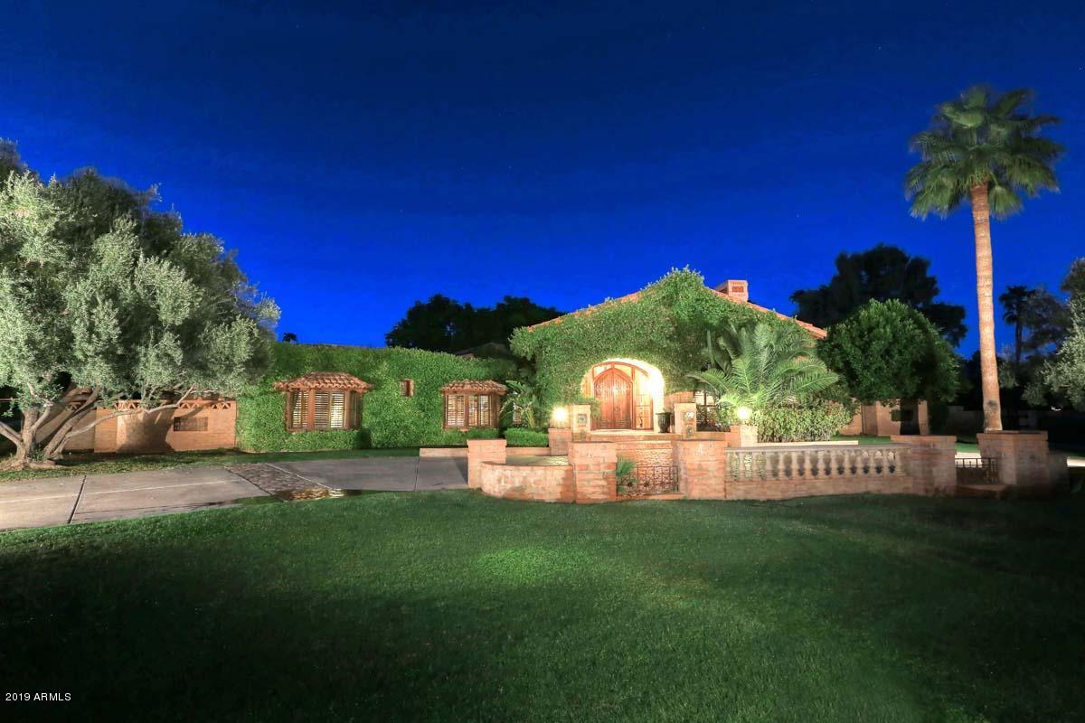 This exceptional home with an emphasis on luxurious comfort is located in the exclusive enclave of Camelback Country Club Estates.  Main house is 5215 sq ft w/ 451 sq ft Casita. Impressive living & dining room w/ gorgeous wood beamed ceilings & fireplace. Rysso-Peters custom cabinetry in kitchen, family room, office & master bath. Kitchen has soap-stone surfaces, glass ceiling originally from Bank of England & cozy fireplace for reading or after dinner drinks. Master suite has dual walk-in closets, steam shower, sitting area w/ fireplace & French doors opening to magnificent, resort like htd salt water pool w/ lounging area, gazebo, fire pit, huge play yard & sports court. Features incl: one bedr guest house w/ kitchenette, brand new bathrooms w glass tile, walnut hardwood & stone floors, fresh paint throughout, new flat roof, Clive Christian bathroom, N/S acre, and 3 C's schools. This unique home boasts the highest finishes and is an entertainer's dream.