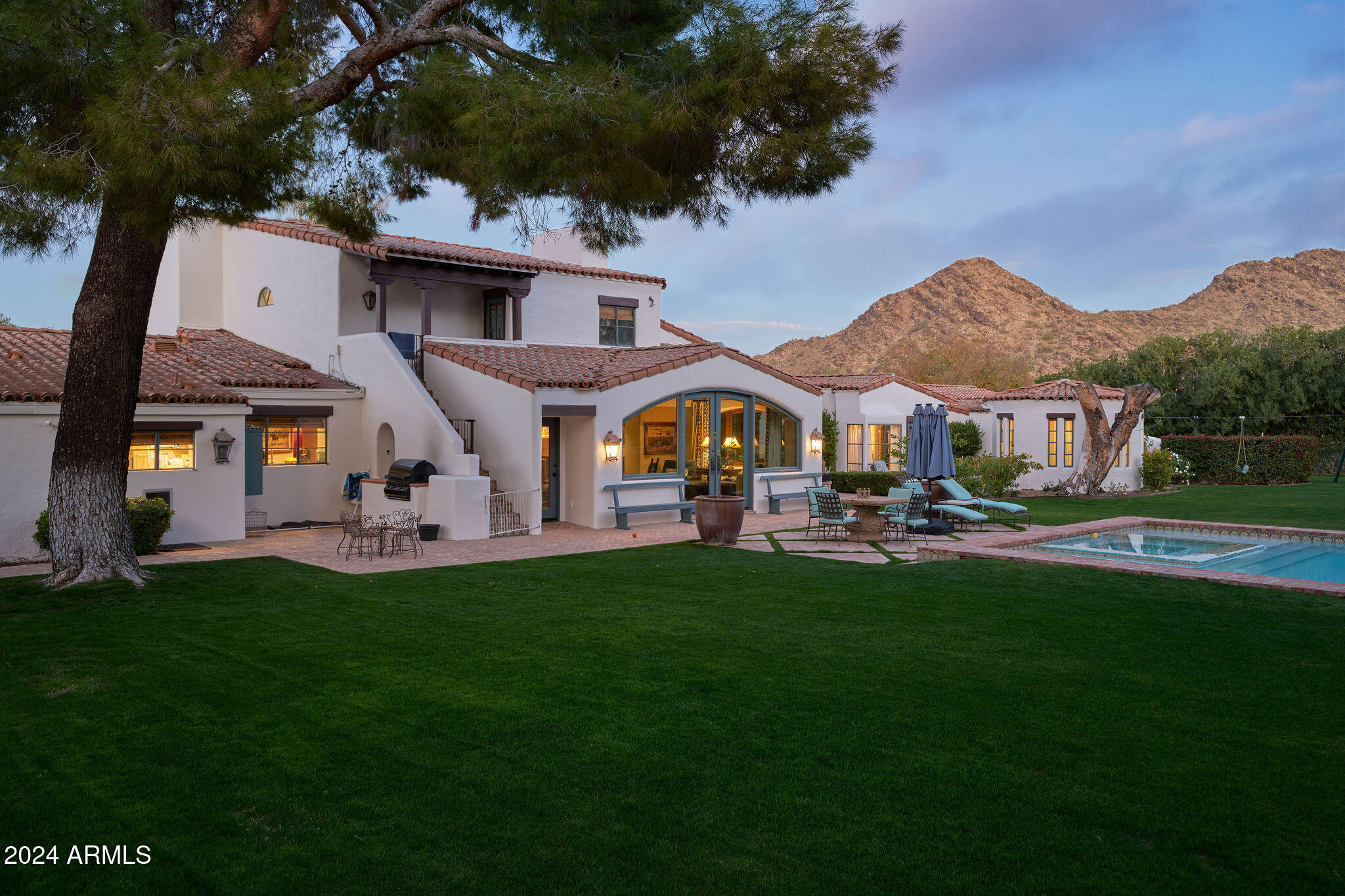 Discover an extraordinary chance to own a timeless masterpiece in the heart of Paradise Valley.  Designed and built by the renowned George Christiansen, this home embodies authentic Spanish architecture at its finest, situated on a breathtaking 2.81-acre lot just north of the prestigious Paradise Valley Country Club. Nestled in a serene and understated cul-de-sac, this property offers the perfect blend of tranquility and convenience.  Its quiet location belies its proximity to all the amenities one could desire, ensuring a lifestyle of ease and elegance. This estate has been thoughtfully updated to enhance its inherent beatify and versatility, blending modern touches with its original architectural charm.  From the handcrafted details to the expansive, private grounds, every inch of this home exudes sophistication and character. 
With a comprehensive ALTA survey included in the documents tab, this property presents an unparalleled opportunity for discerning buyers seeking both heritage and potential.  Don't miss your chance to own a one-of-a-kind piece of Paradise Valley history- there is simply nothing else like it on the market.