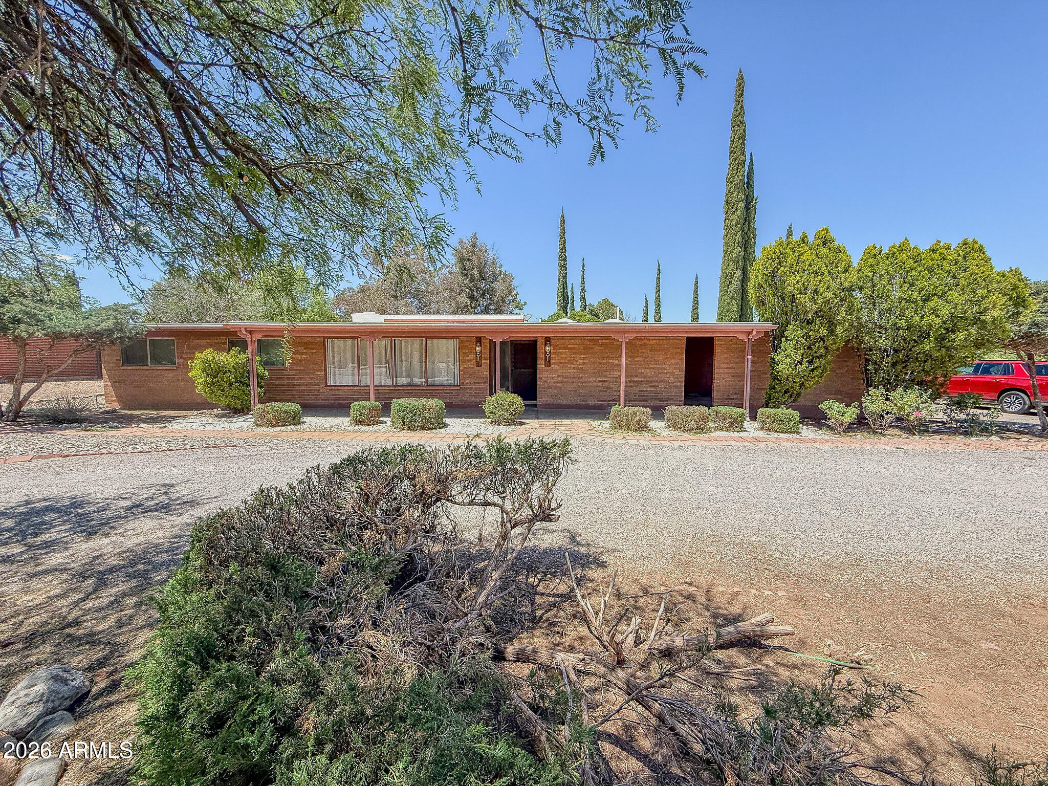 Welcome home to this spacious 4-bedroom, 2-bath property offering approximately 2,300 sq ft of comfortable living space on a generous half-acre lot in Sierra Vista. With room to spread out both inside and out, this home offers the perfect blend of space, functionality, and convenience. The thoughtfully designed floor plan features multiple living areas, sizable bedrooms, and ample natural light throughout. Outside, the oversized lot offers endless possibilities for entertaining, gardening, pets, or simply enjoying Arizona's beautiful sunsets and open skies. Conveniently located near shopping, dining, schools, and Ft. Huachuca, this property combines peaceful living with easy access to everyday amenities.