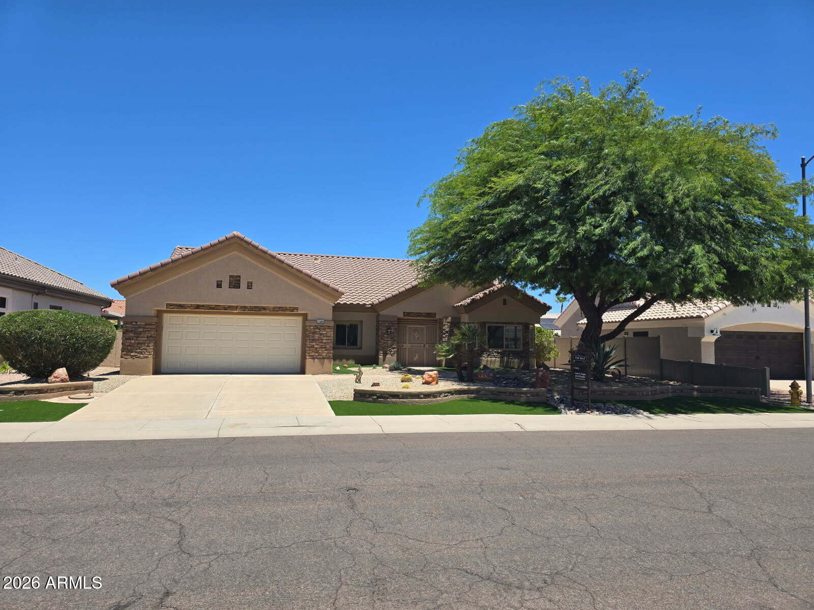 Meticulously maintained Chandler model featuring 2 bedrooms, 1.75 baths, plus a versatile office or hobby room. Bright open floor plan with upgraded double-pane energy-efficient windows and vertical blinds throughout. Spacious kitchen offers a breakfast nook, an electric range and large pantry. Extensive upgrades include updated flooring, built in garage cabinets and renovated bathrooms. Enjoy low-maintenance desert landscaping front and back with artificial turf, resurfaced patio deck, large covered patio, and fully block-fenced private north-facing backyard. Enhanced curb appeal with stone veneer accents and added  privacy with secondary screened security entry door.